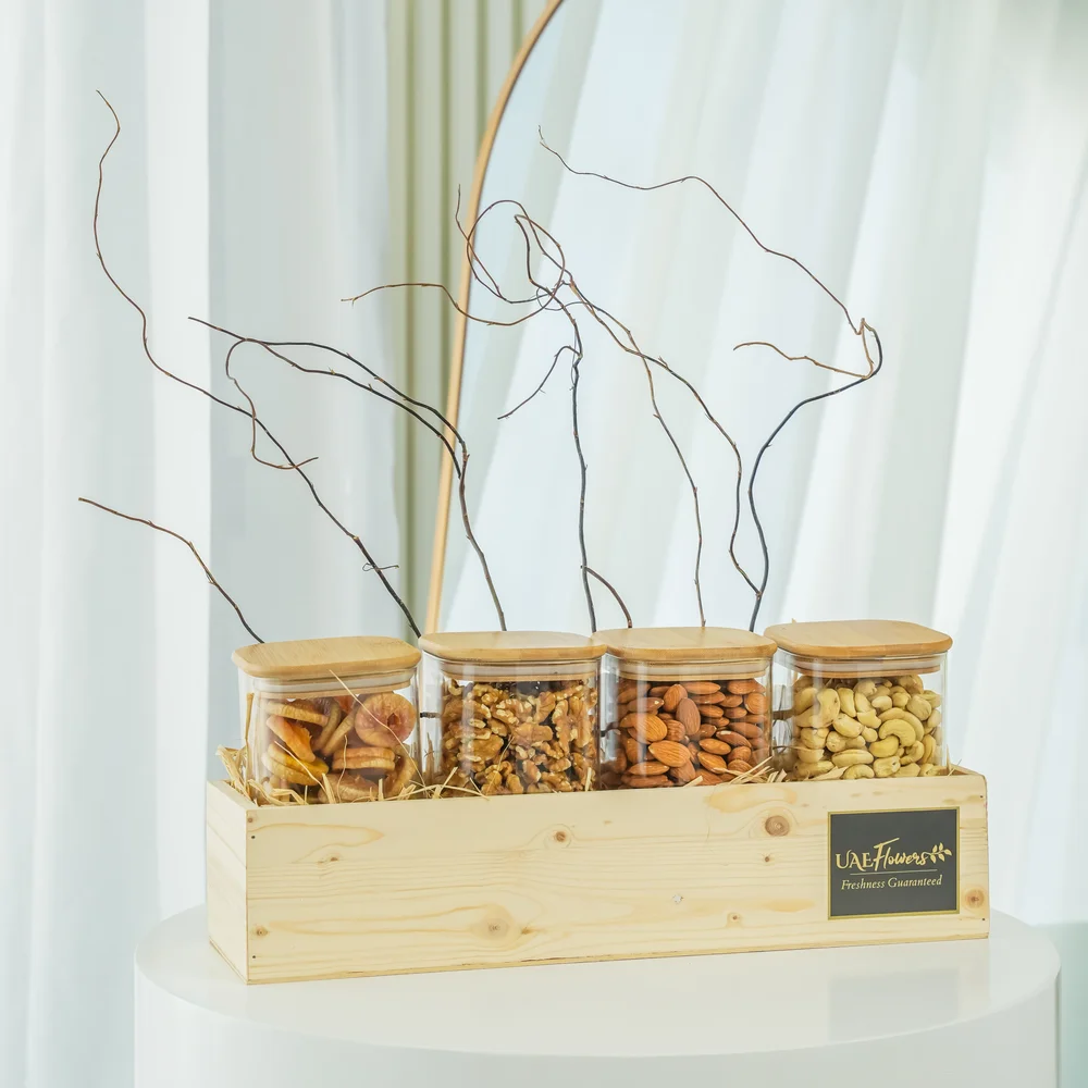 Sets of Dried Figs, Walnuts, Almonds and Cashew in a wooden tray.