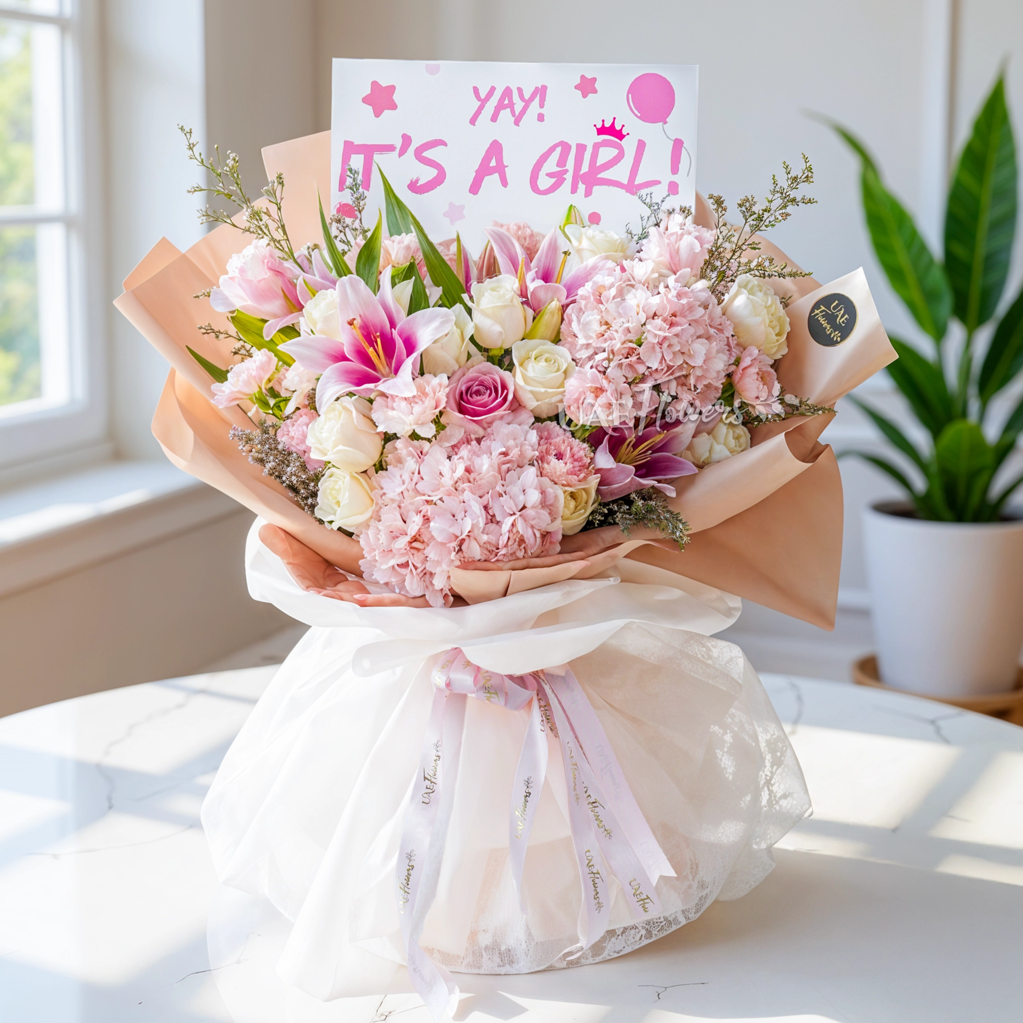 Bouquet of 2 pink hydrangeas, 2 pink lilies, 10 white roses and 5 pink carnations with limonium fillers in nice wrapping