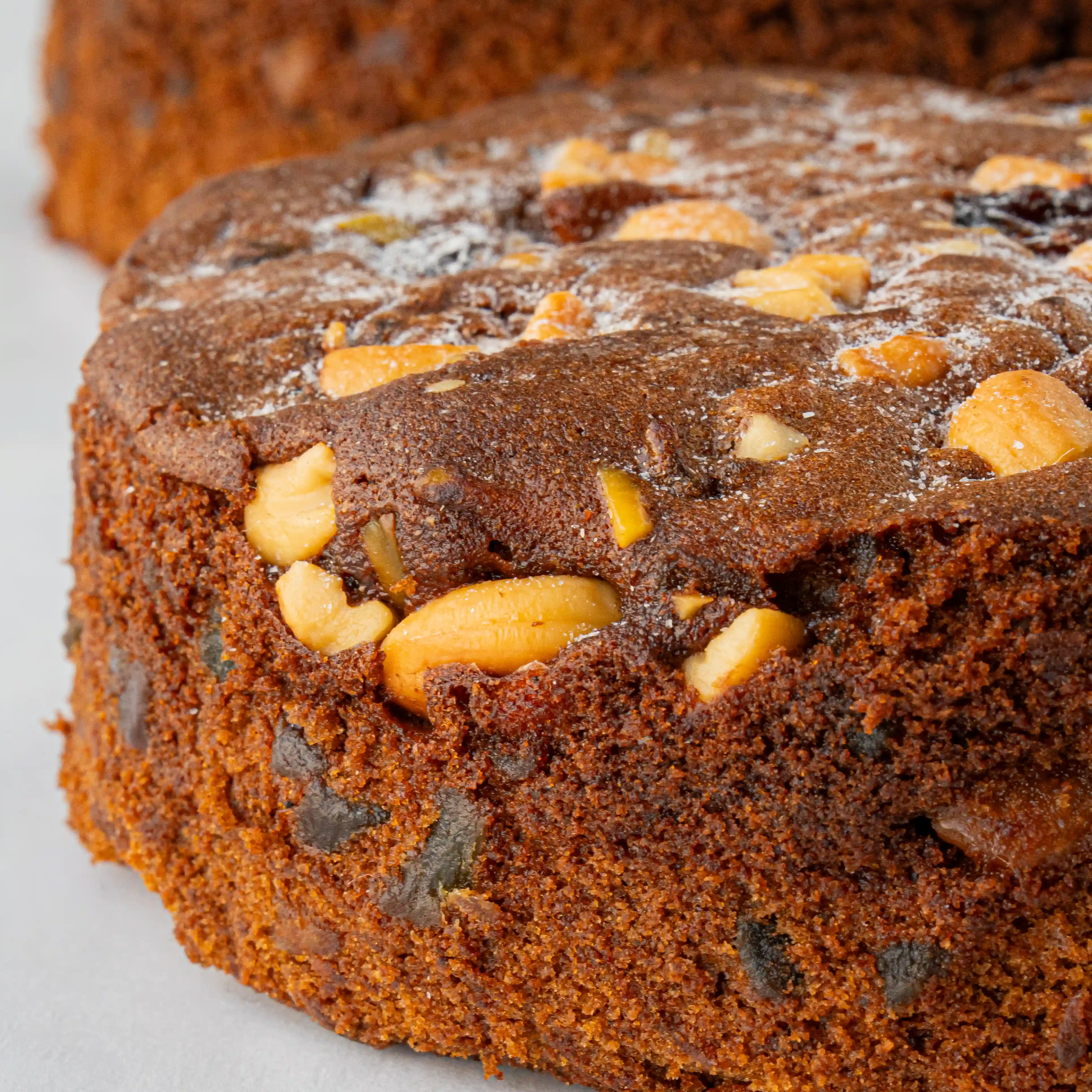 1 kg traditional plum cake topped with dried fruits and nuts