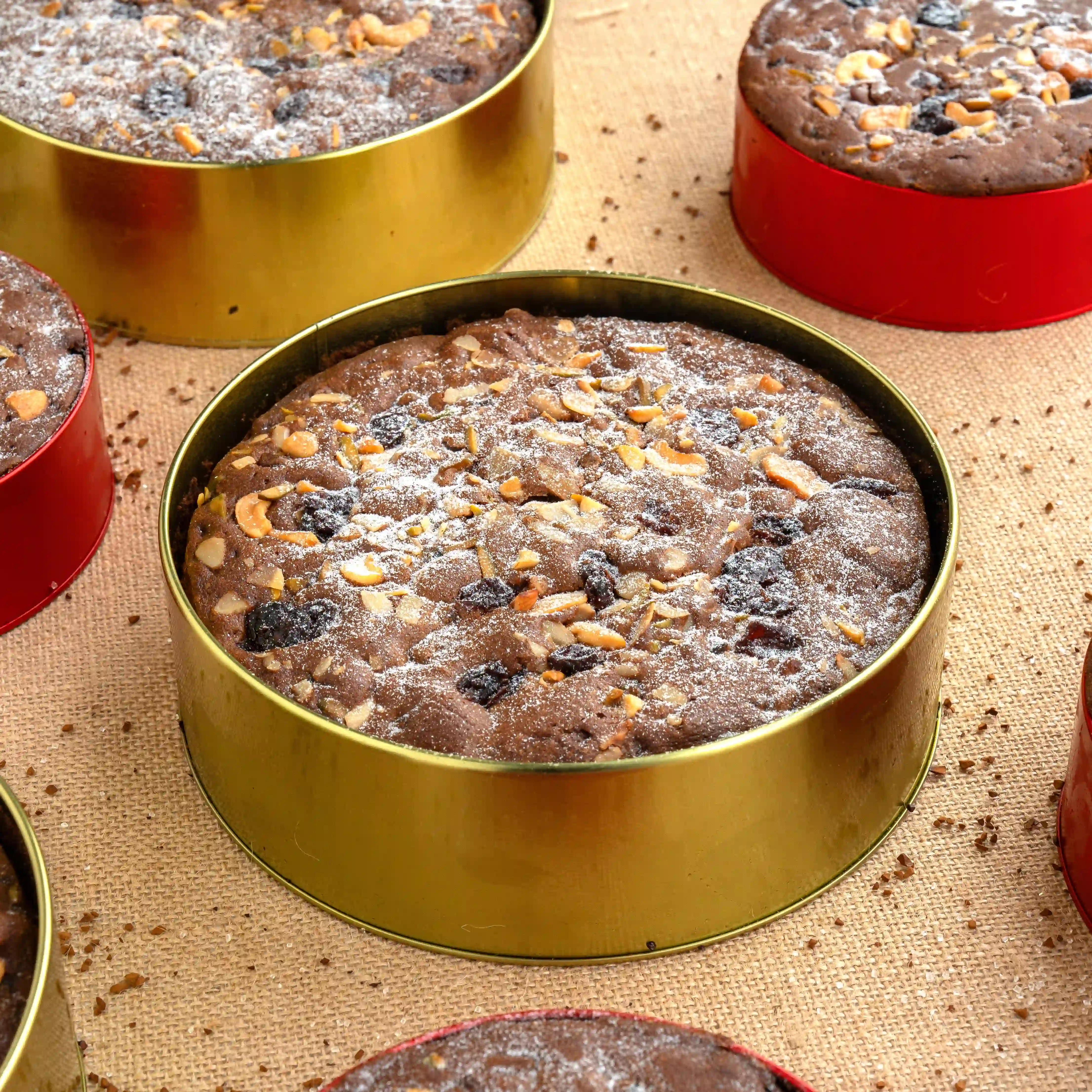 1 kg traditional plum cake topped with dried fruits and nuts