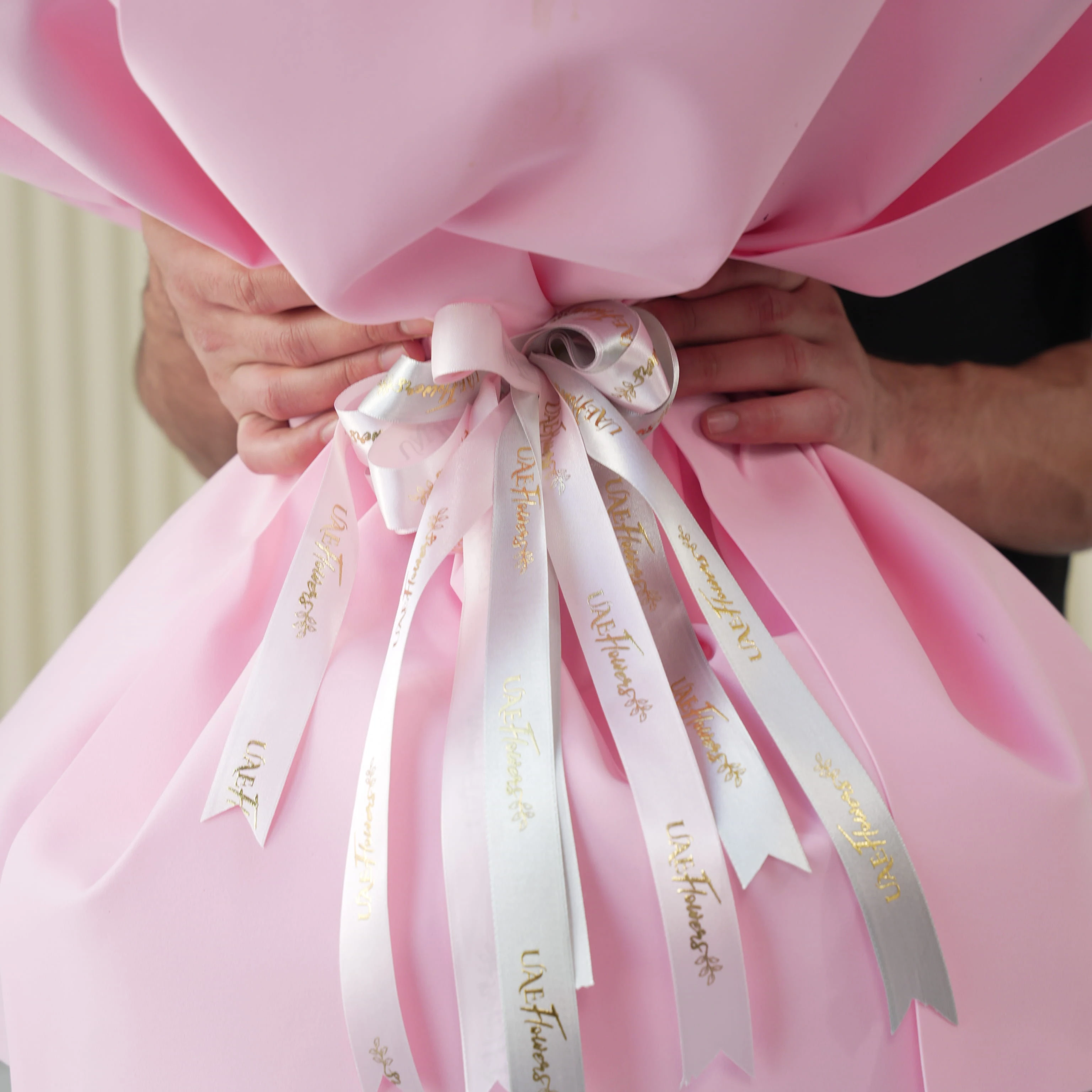 Bouquet of 10 purple matthiola, 10 white chrysanthemums, 10 purple lisianthus, 30 pink carnations and 50 pink roses with green fillers in nice wrapping.