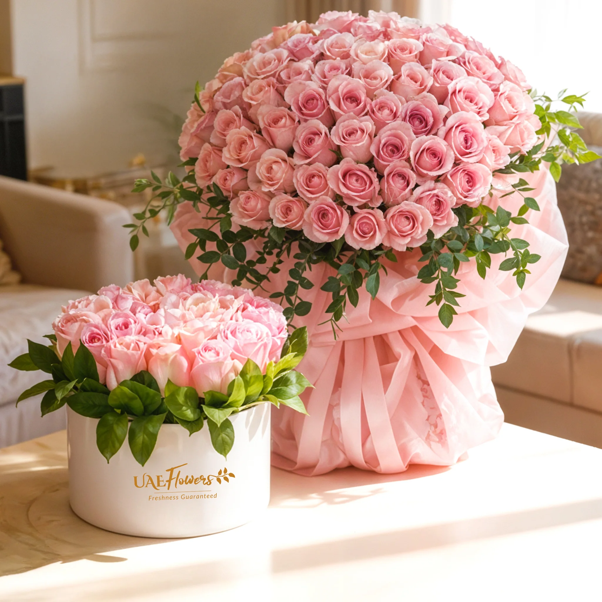 A bouquet of 40 soft pink roses with a box arrangement of 30 pink roses