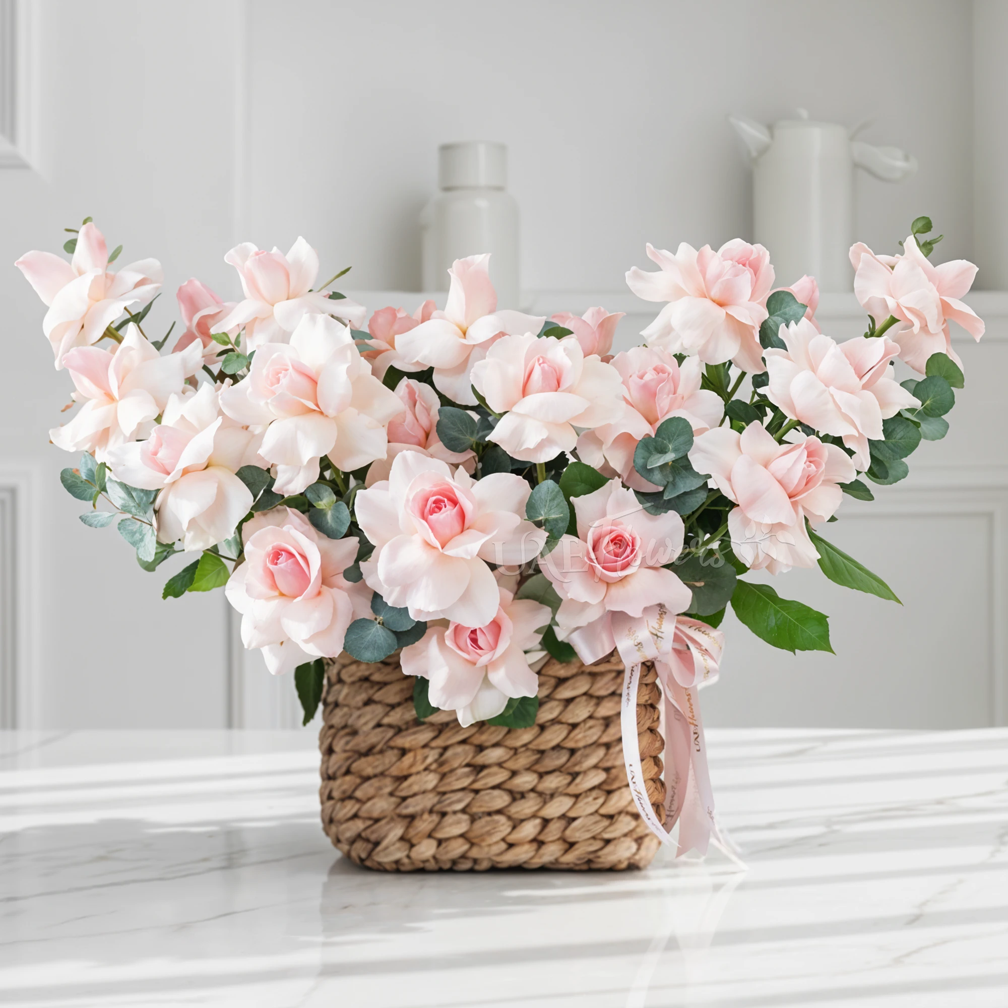 17 opened pink roses with green fillers in a basket.