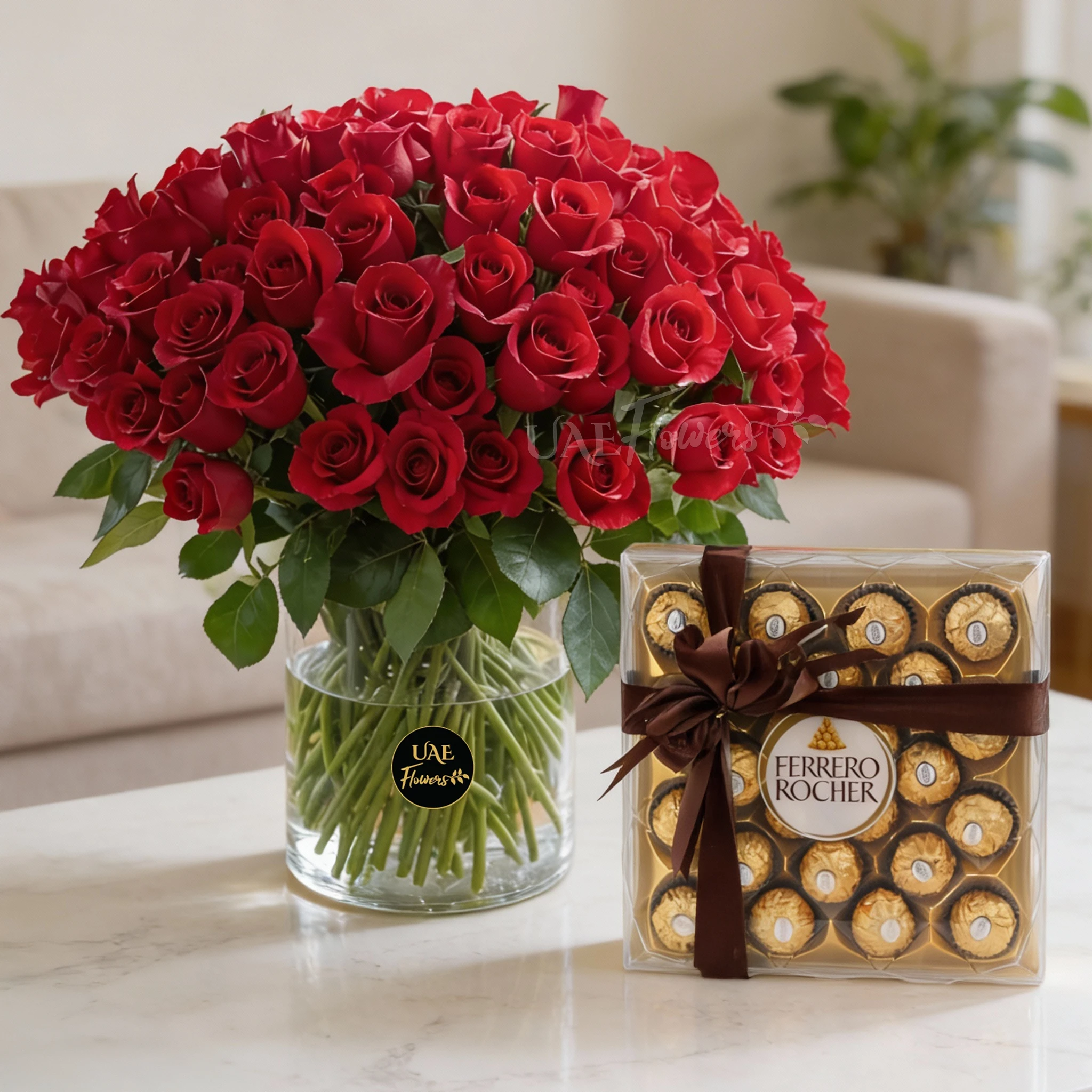 100 red roses with green fillers in a glass vase and 24 pcs Ferrero rocher chocolate.