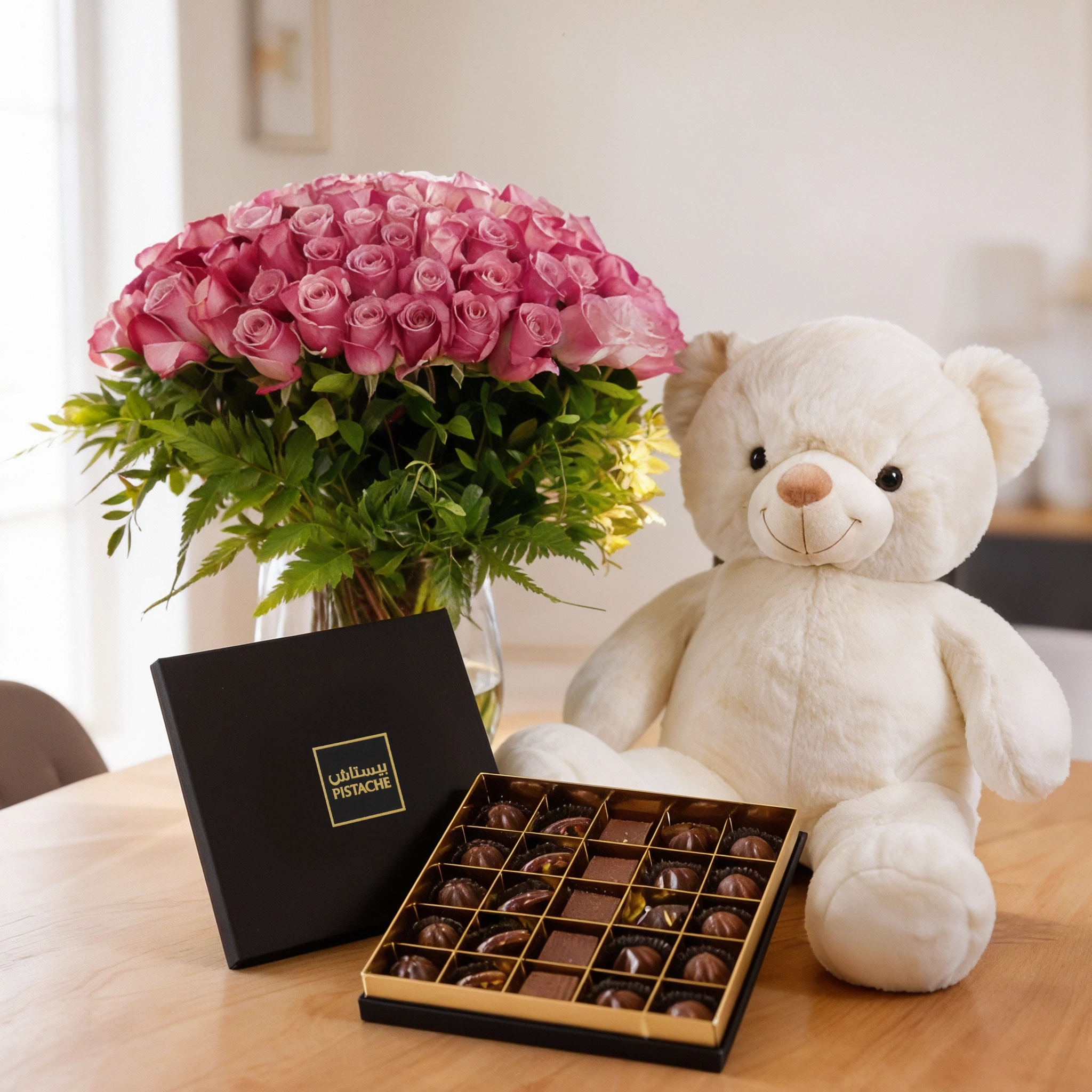 100 purple roses with green fillers in a glass vase, medium white teddy bear and 25 Pcs Pistache Signature Temptation Chocolate Box.