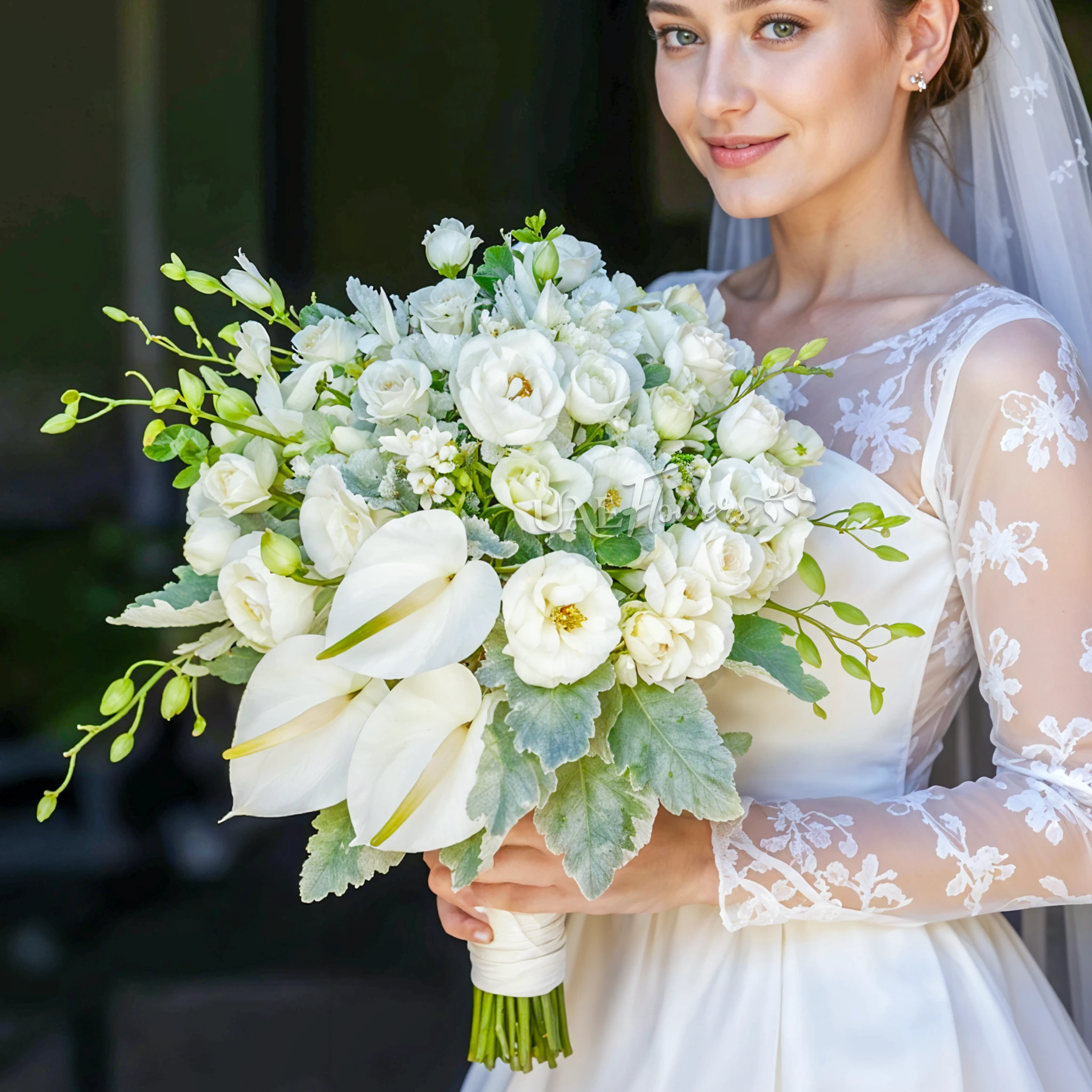 Bridal hand-tied bouquet of 10 white orchids, 3 white anthuriams, 5 white lisianthus and 10 white ranunculus.