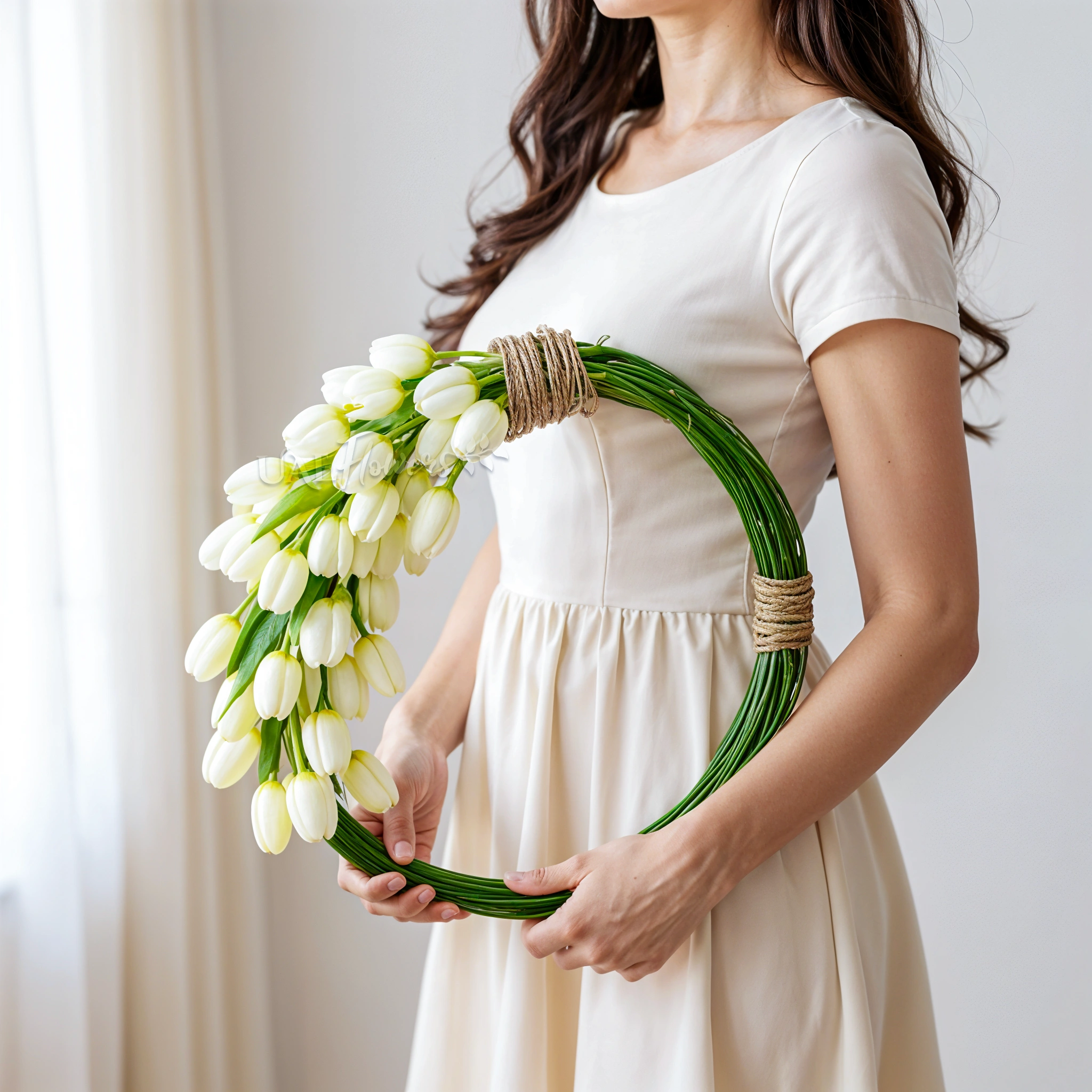Bridal hand-tied round arrangement of 30 white tulips and 3 bundles of steel grass.