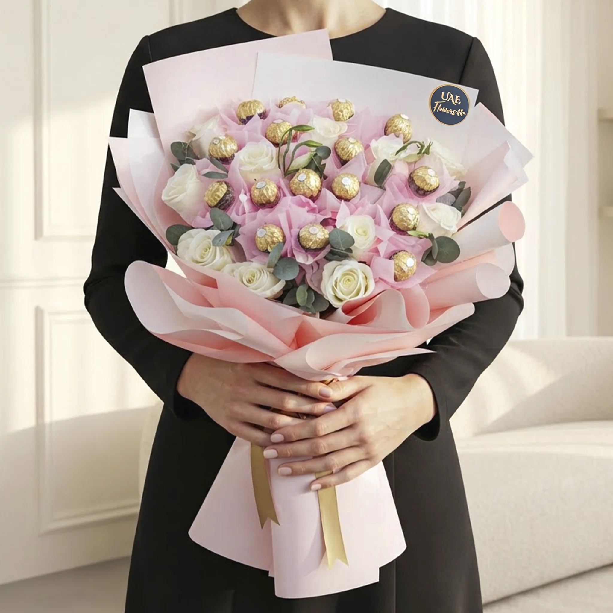 Blush Ferrero Bouquet with white roses, pink floral accents, eucalyptus leaves, and Ferrero Rocher chocolates wrapped in premium pink paper.