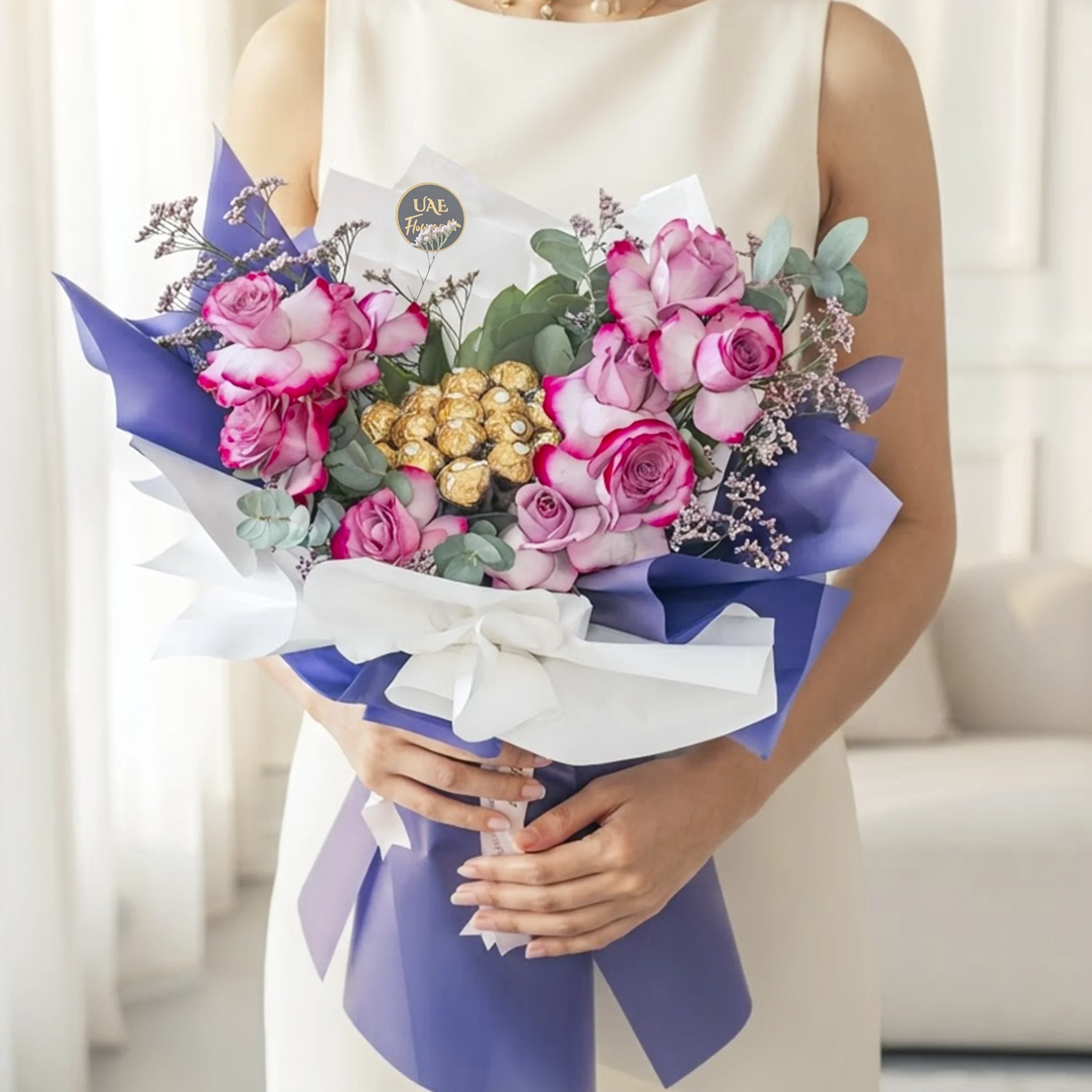 Purple Dream Ferrero Bouquet with purple roses, Ferrero Rocher chocolates, eucalyptus leaves, and luxury purple white wrapping for special occasions.