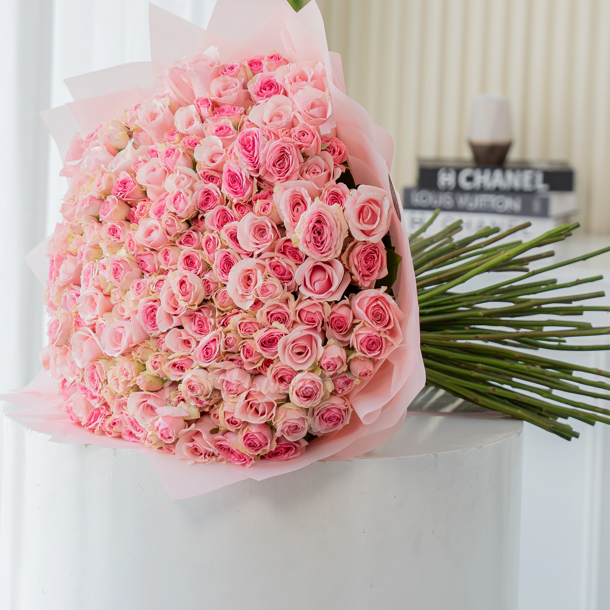 200 pink spray roses bouquet in blush wrapping