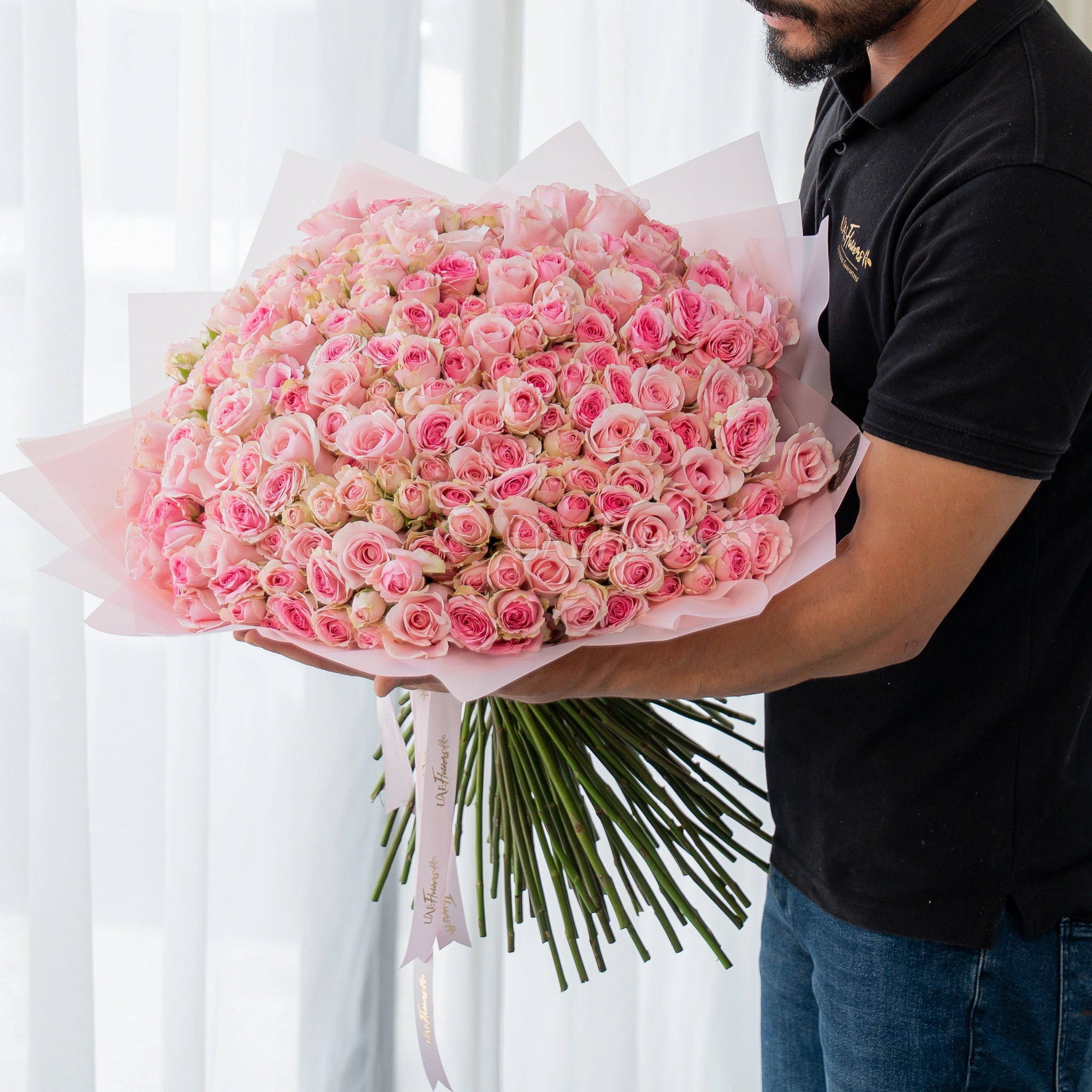 200 pink spray roses bouquet in blush wrapping