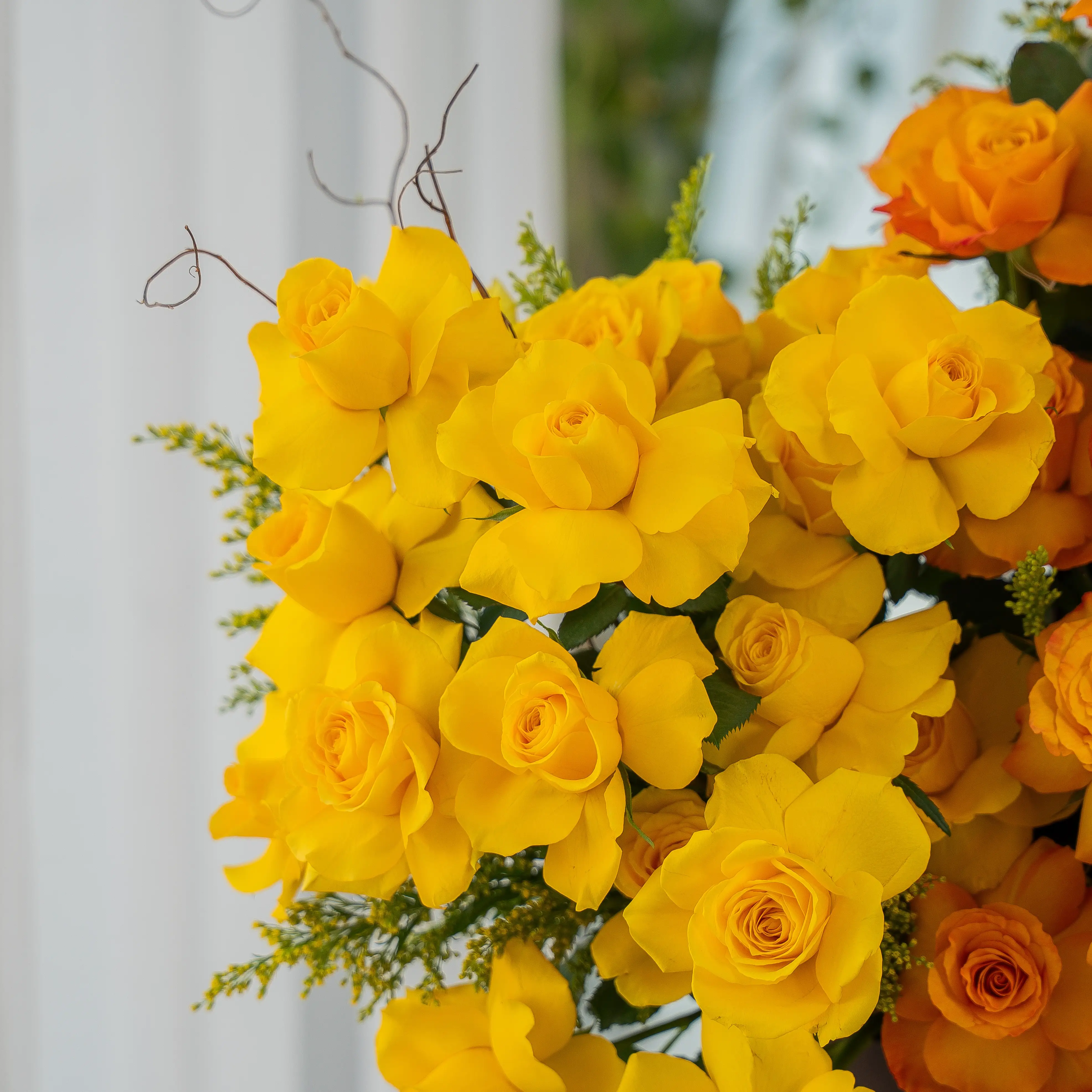 Yellow and orange roses in luxury hatbox for Diwali by UAE Flowers Dubai