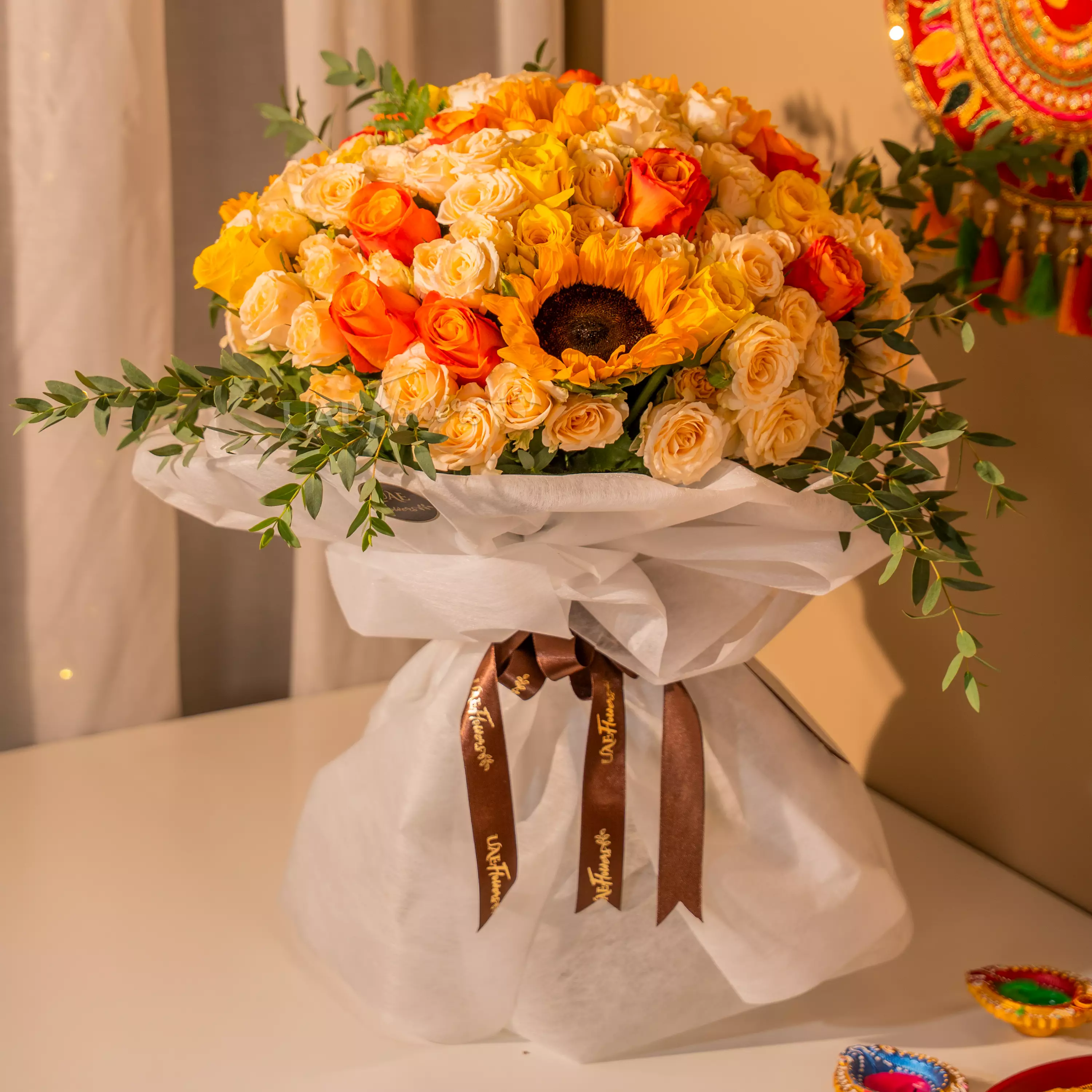 Sunflowers, yellow and orange roses bouquet for Diwali by UAE Flowers Dubai