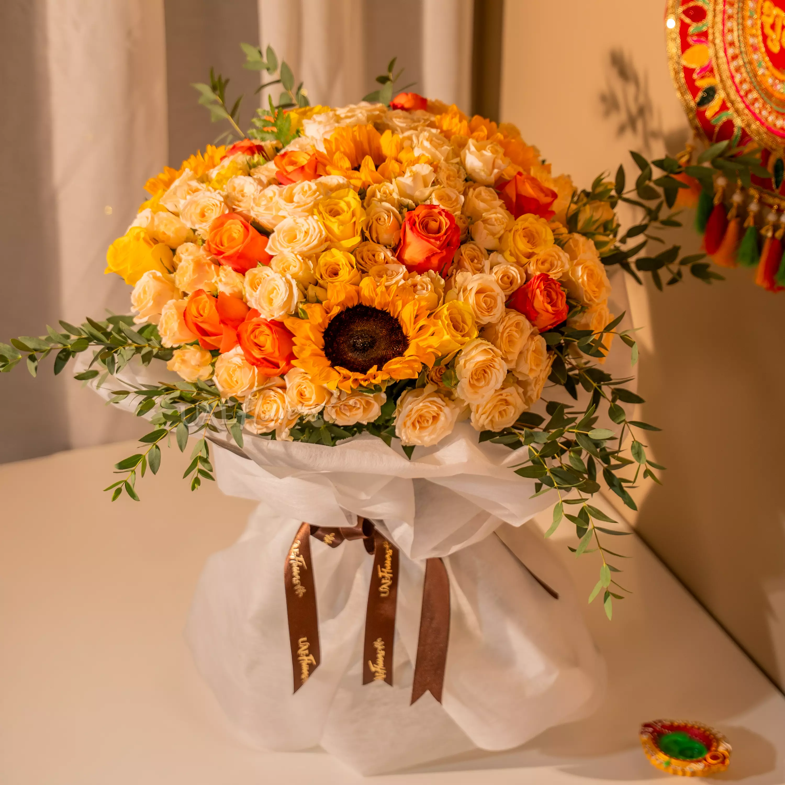 Sunflowers, yellow and orange roses bouquet for Diwali by UAE Flowers Dubai