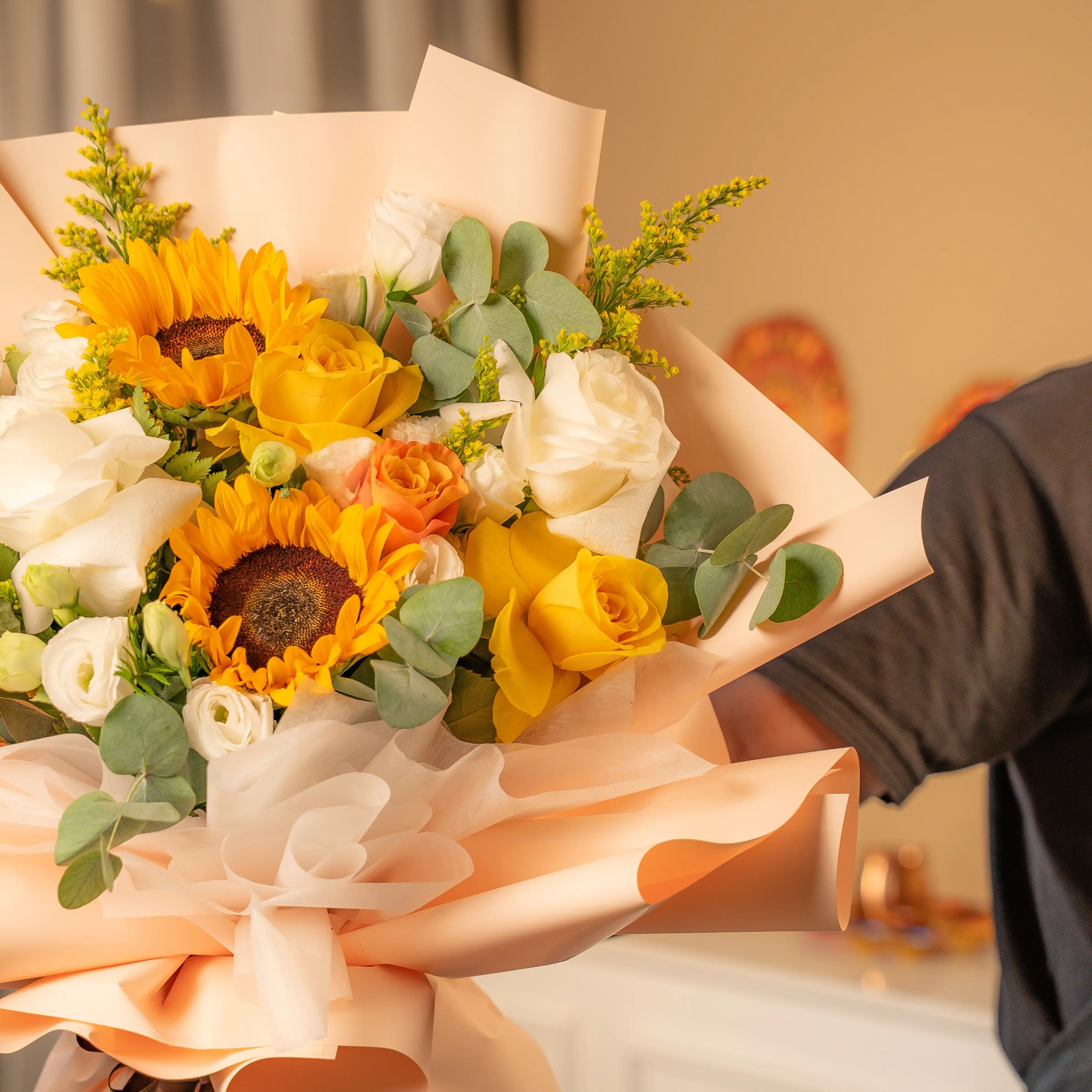 Sunflowers, yellow and white roses bouquet wrapped for Diwali by UAE Flowers Dubai