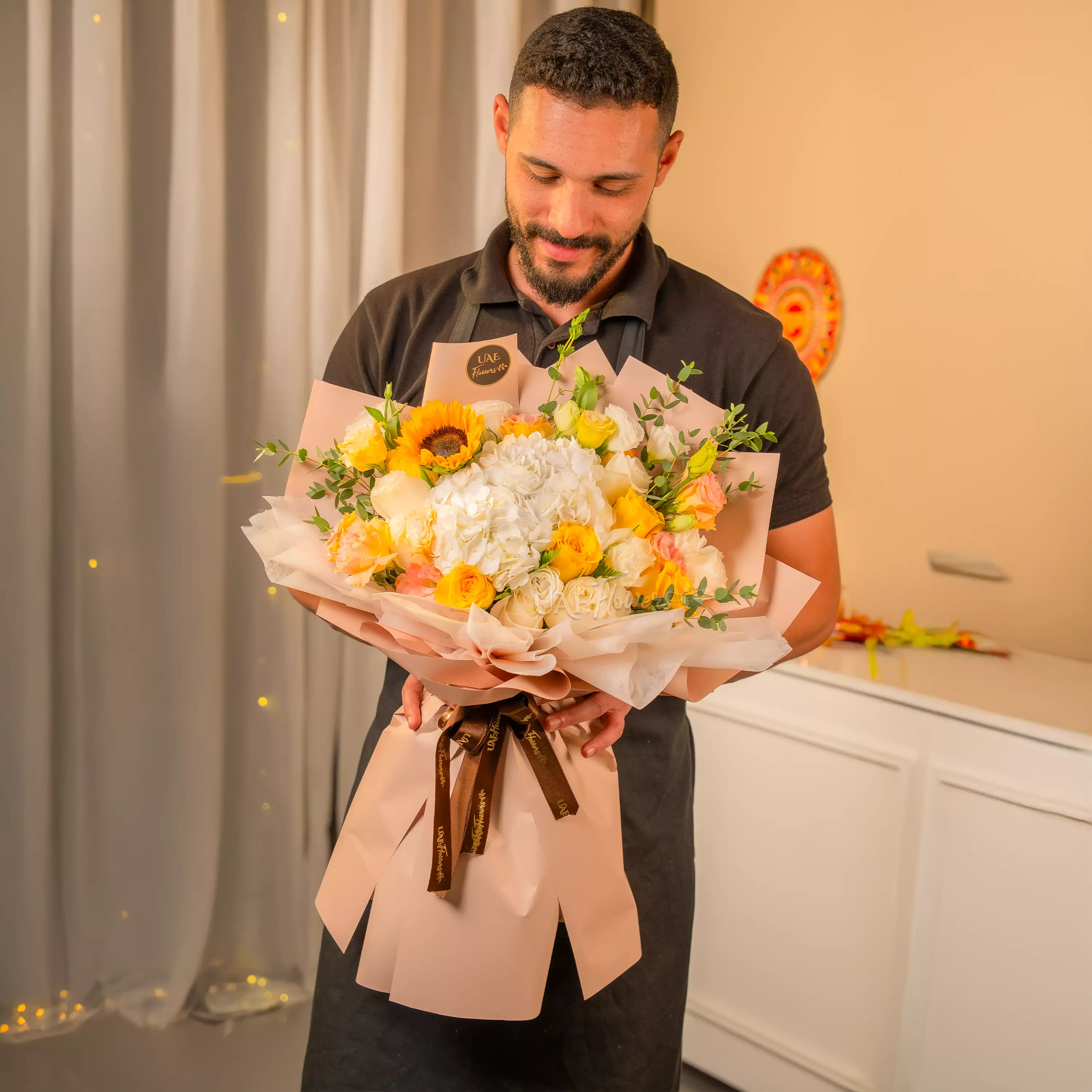 Sunflowers, white hydrangeas, and roses bouquet for Diwali by UAE Flowers Dubai