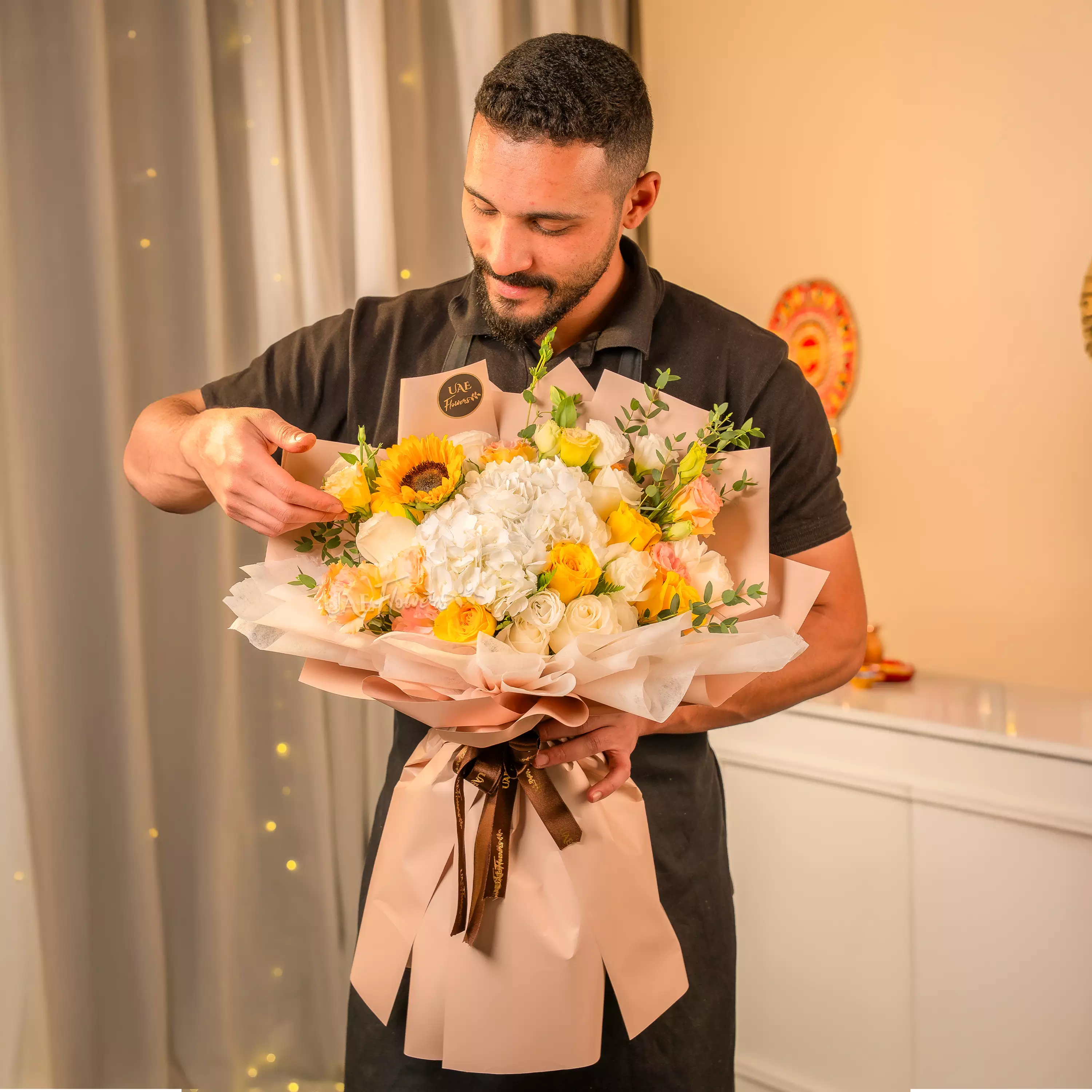Sunflowers, white hydrangeas, and roses bouquet for Diwali by UAE Flowers Dubai
