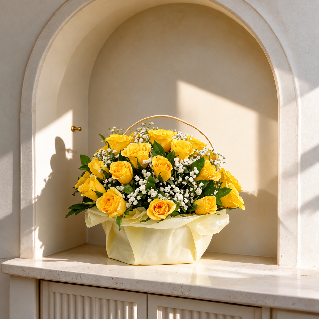 Yellow rose flower basket with white baby's breath and fresh green foliage