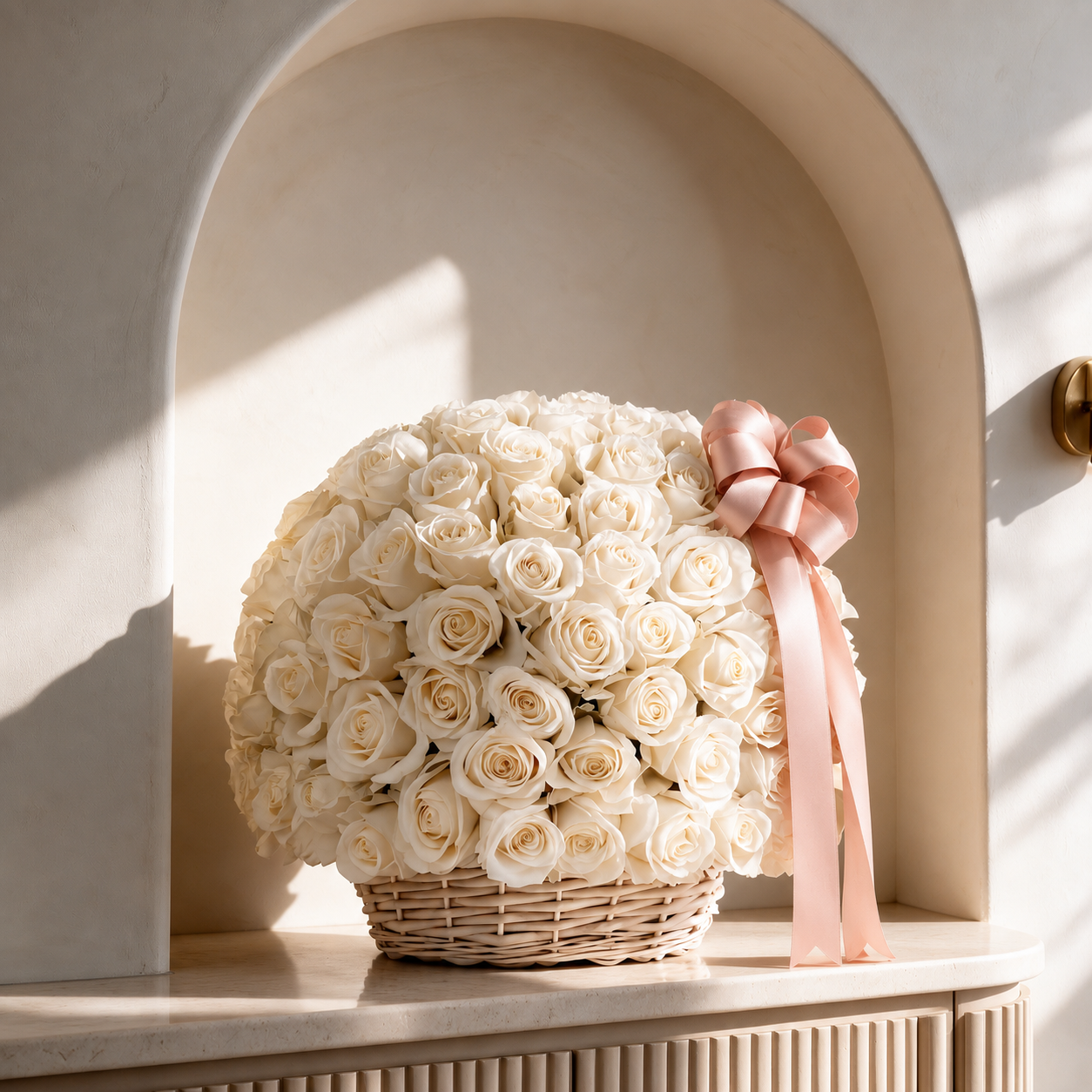 Luxurious ivory rose basket with a blush pink satin ribbon