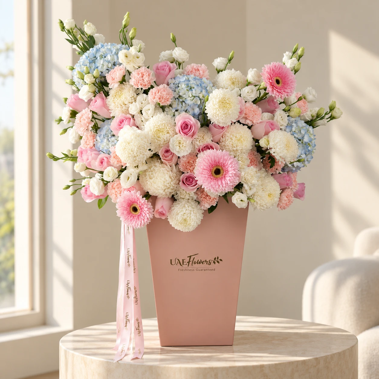 Luxury pink rose and blue hydrangea flower box with pink carnations, gerberas, white chrysanthemums and lisianthus by UAE Flowers Dubai.