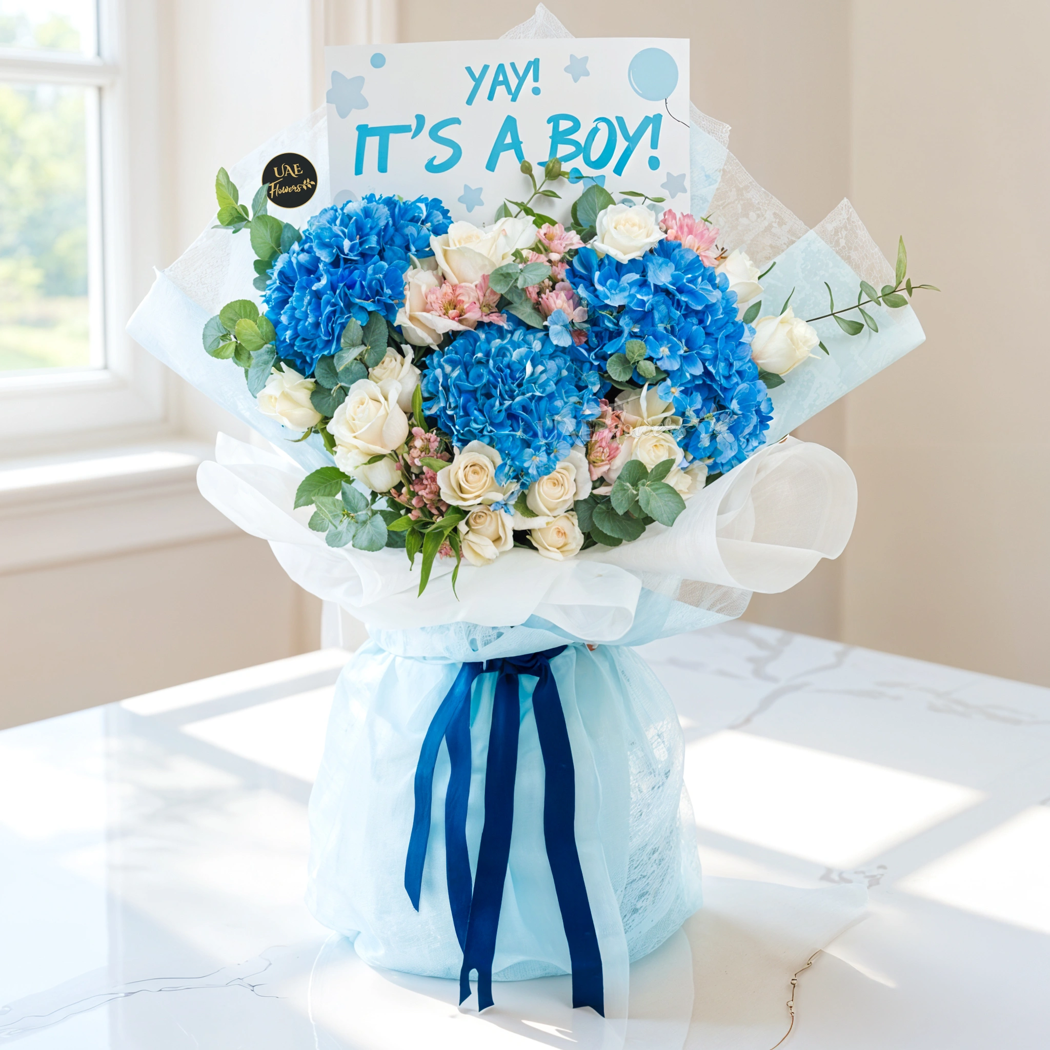 Bouquet of 3 blue hydrangeas, 15 white roses and 3 pink alstromeria with greens in nice wrapping.