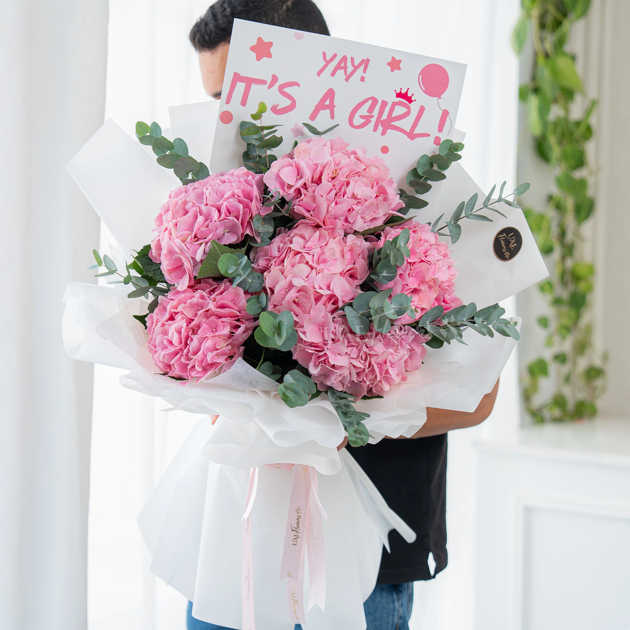 Bouquet of 6 pink hydrangeas with greens in nice wrapping.