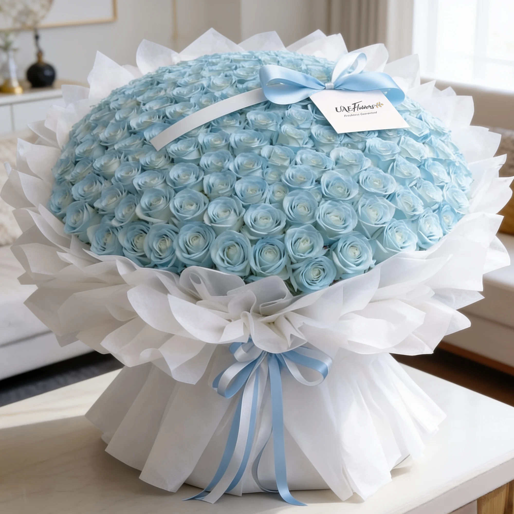 100 blue roses bouquet with luxurious white wrapping and blue ribbon bow