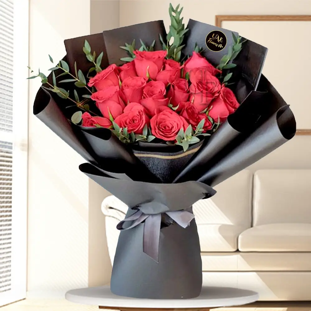 bouquet of 15 red roses arranged with green fillers