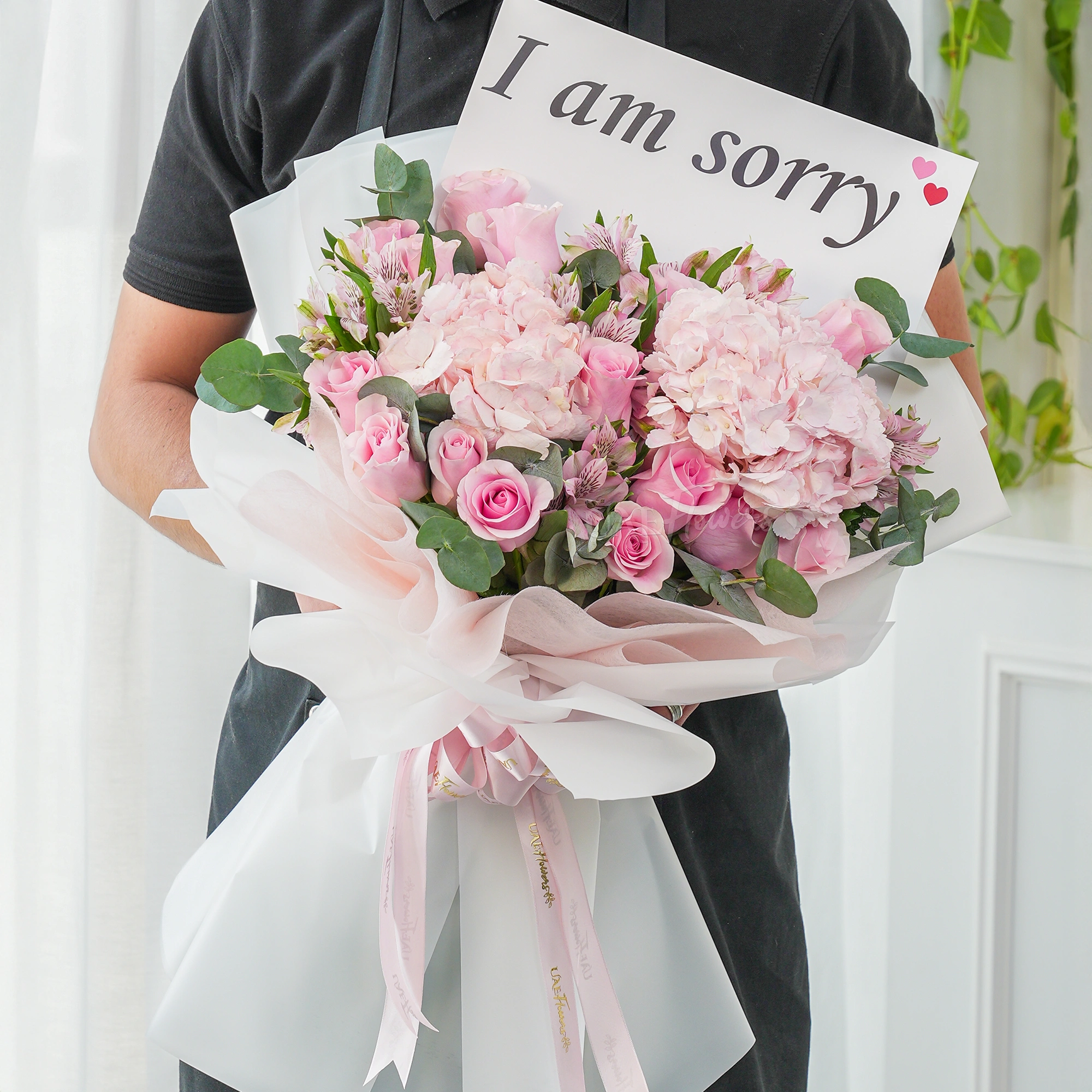 Bouquet of 12 pink roses, 2 pink hydrangeas and 3 pink alstromeria with green fillers