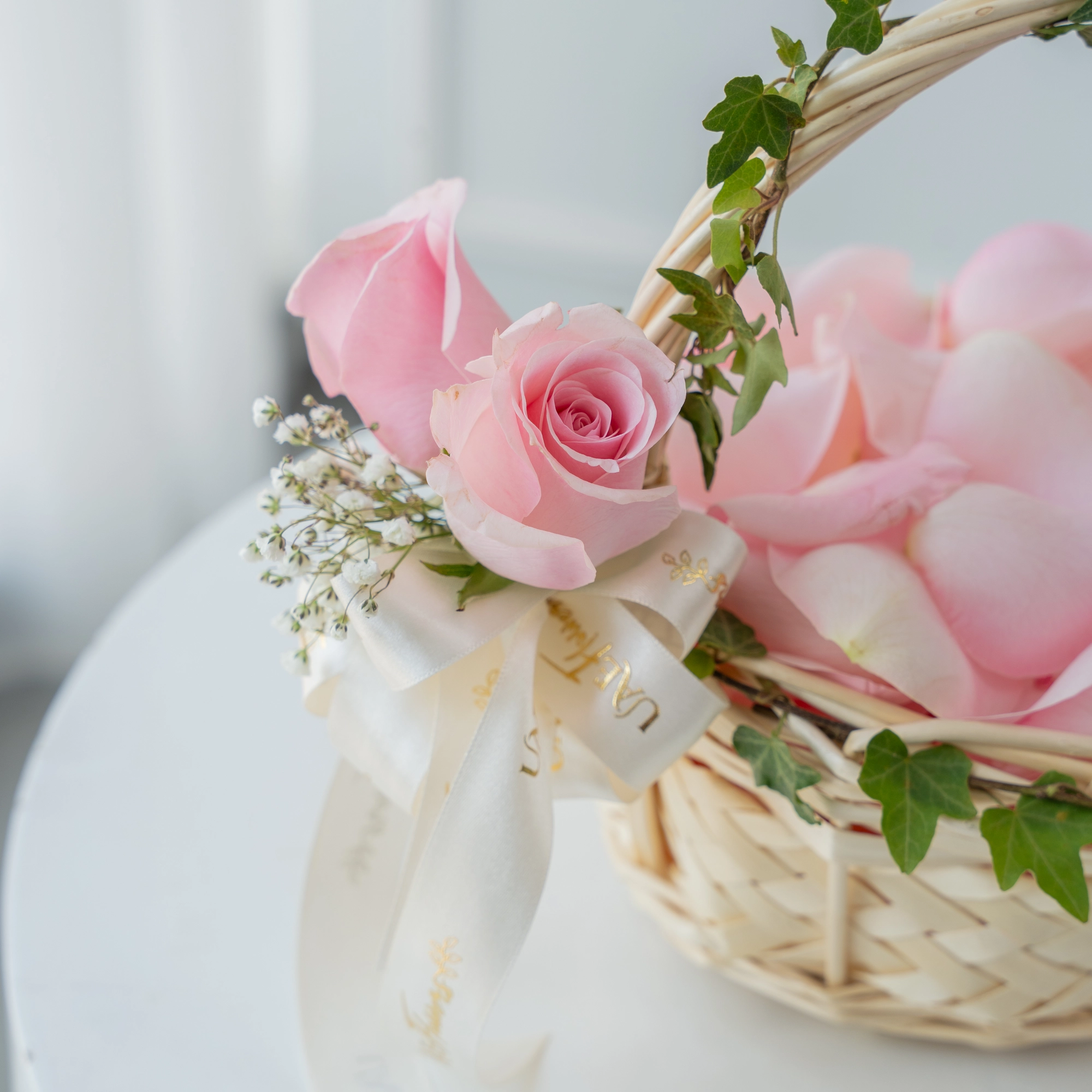 small basket of fresh pink rose petals