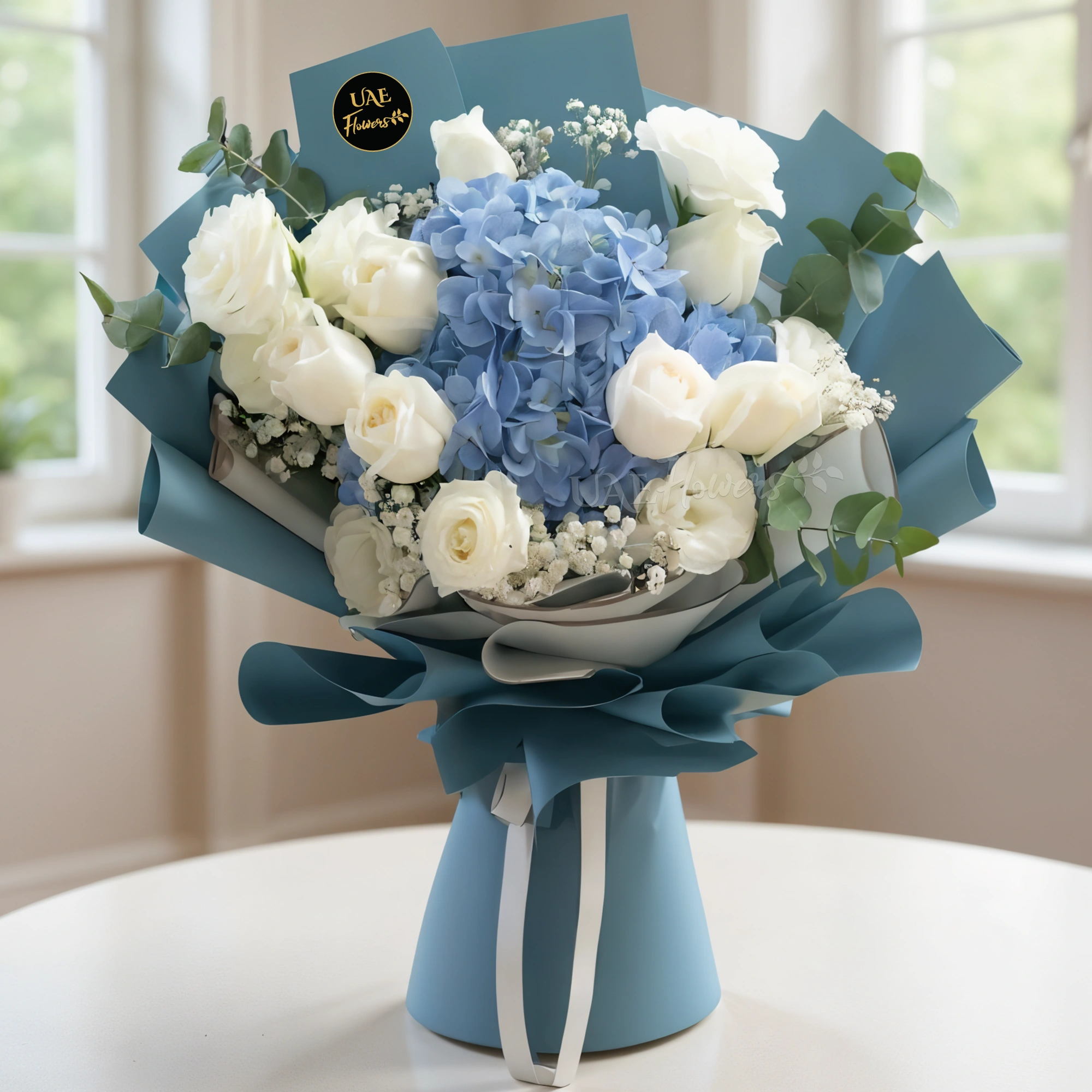 A bouquet of 1 blue hydrangea and 14 white rose with baby breath in blue and white wrapping paper tied with white ribbon