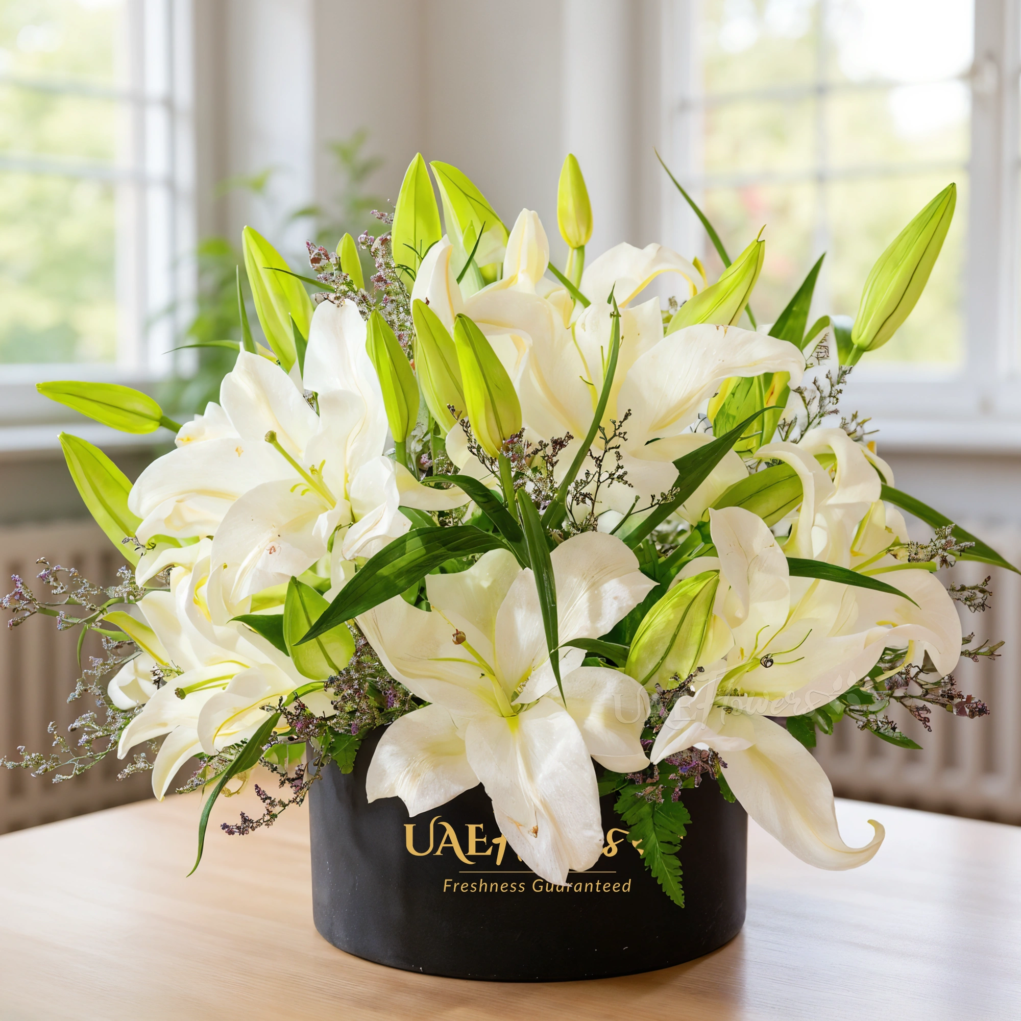 6 white lilies with limonium and green fillers in a black box