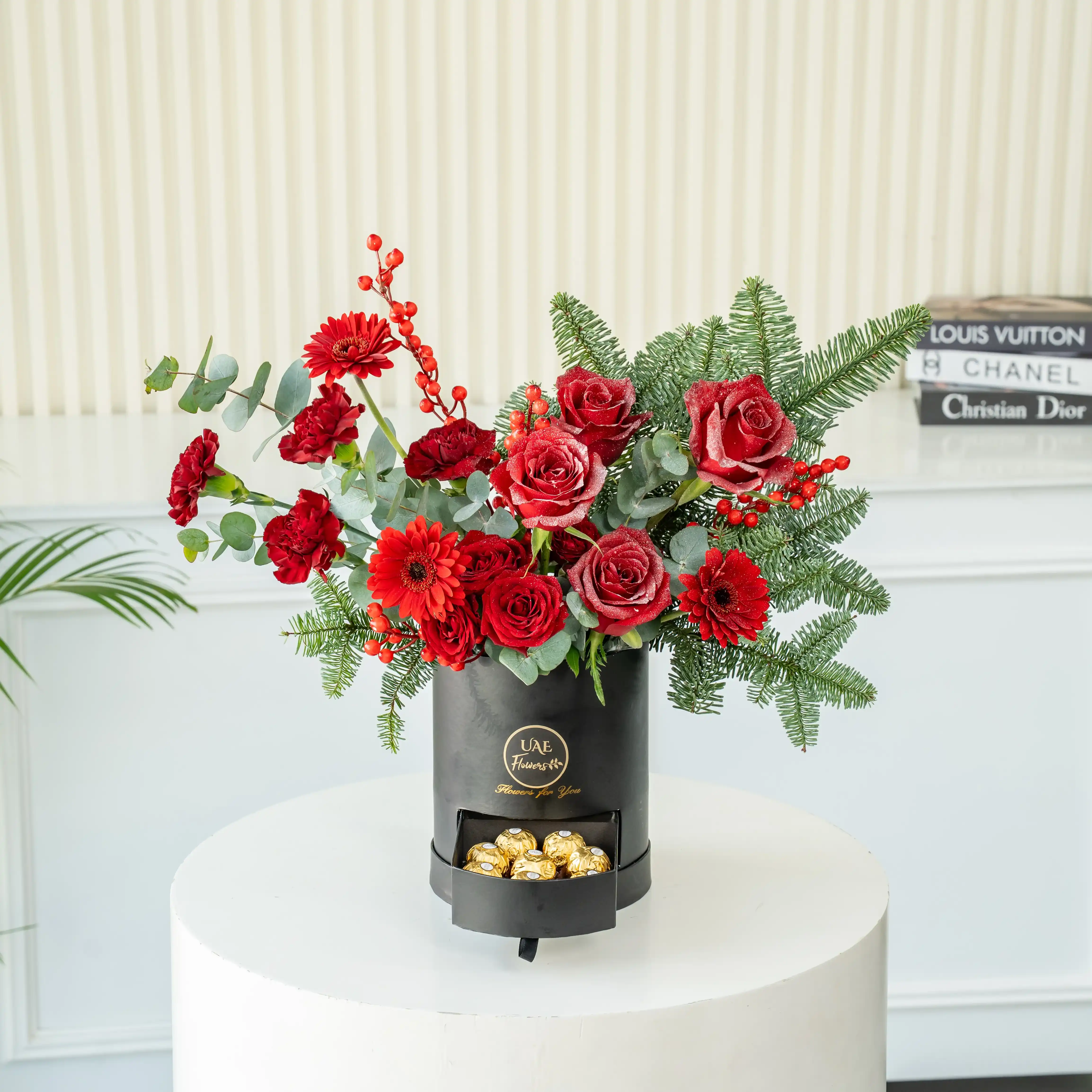Red rose and pine Christmas flower box with chocolates