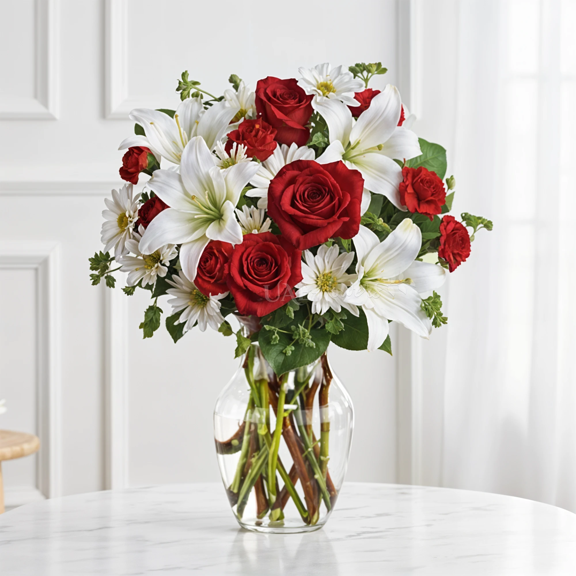 7 red carnations, 2 white lilies, 9 red roses, and 4 white chrysanthemums in a vase