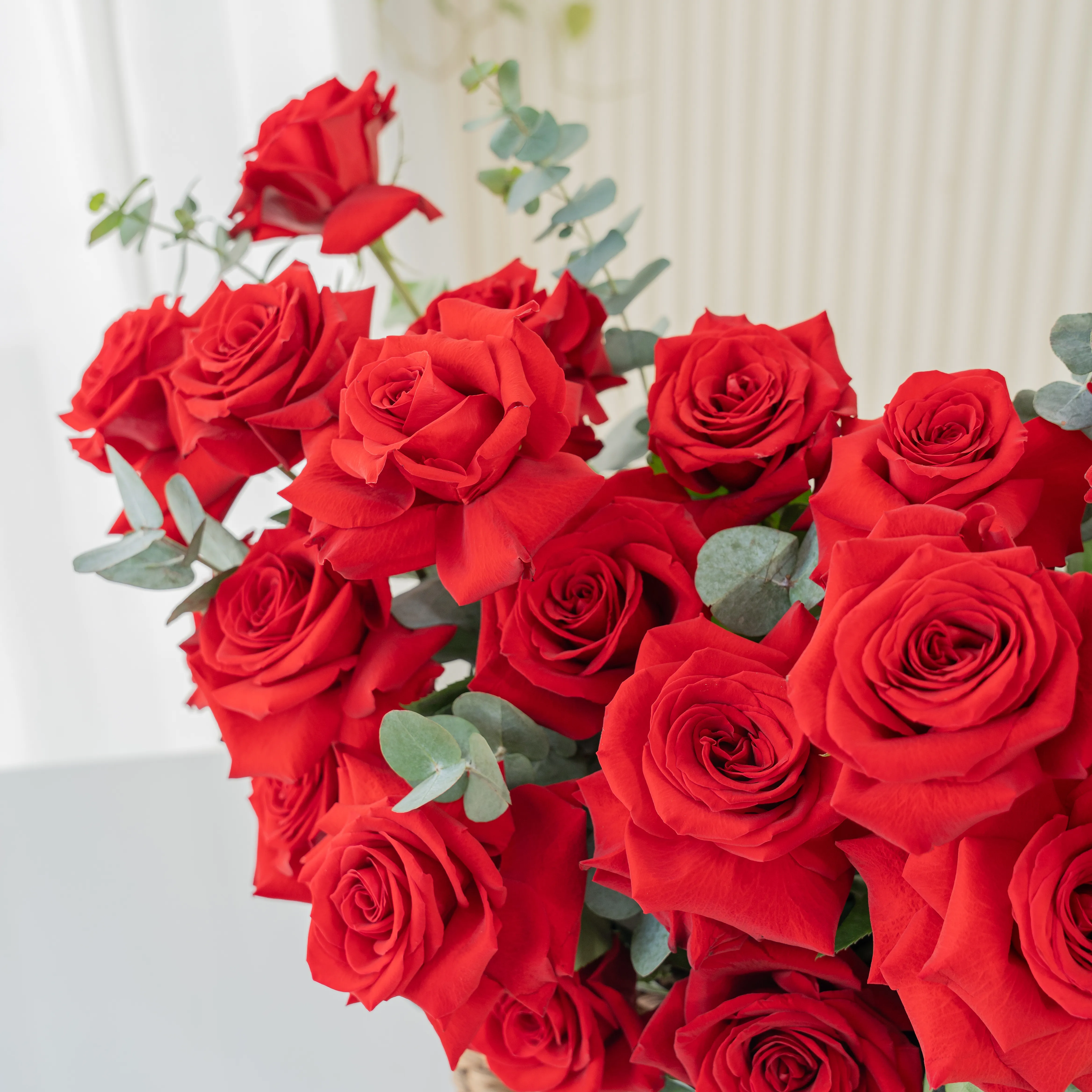 20 Opened Red Roses in a Basket with Fillers