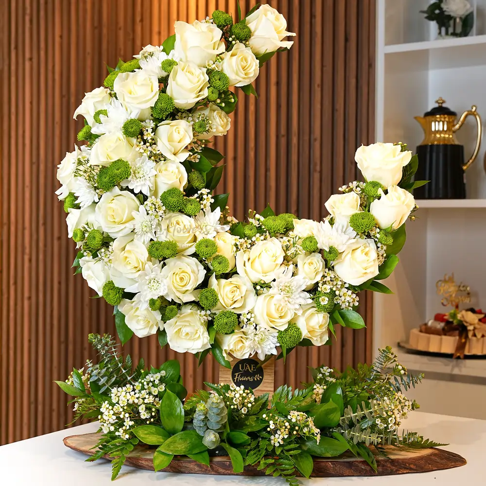 35 white roses and chrysanthemums arranged on a moon stand