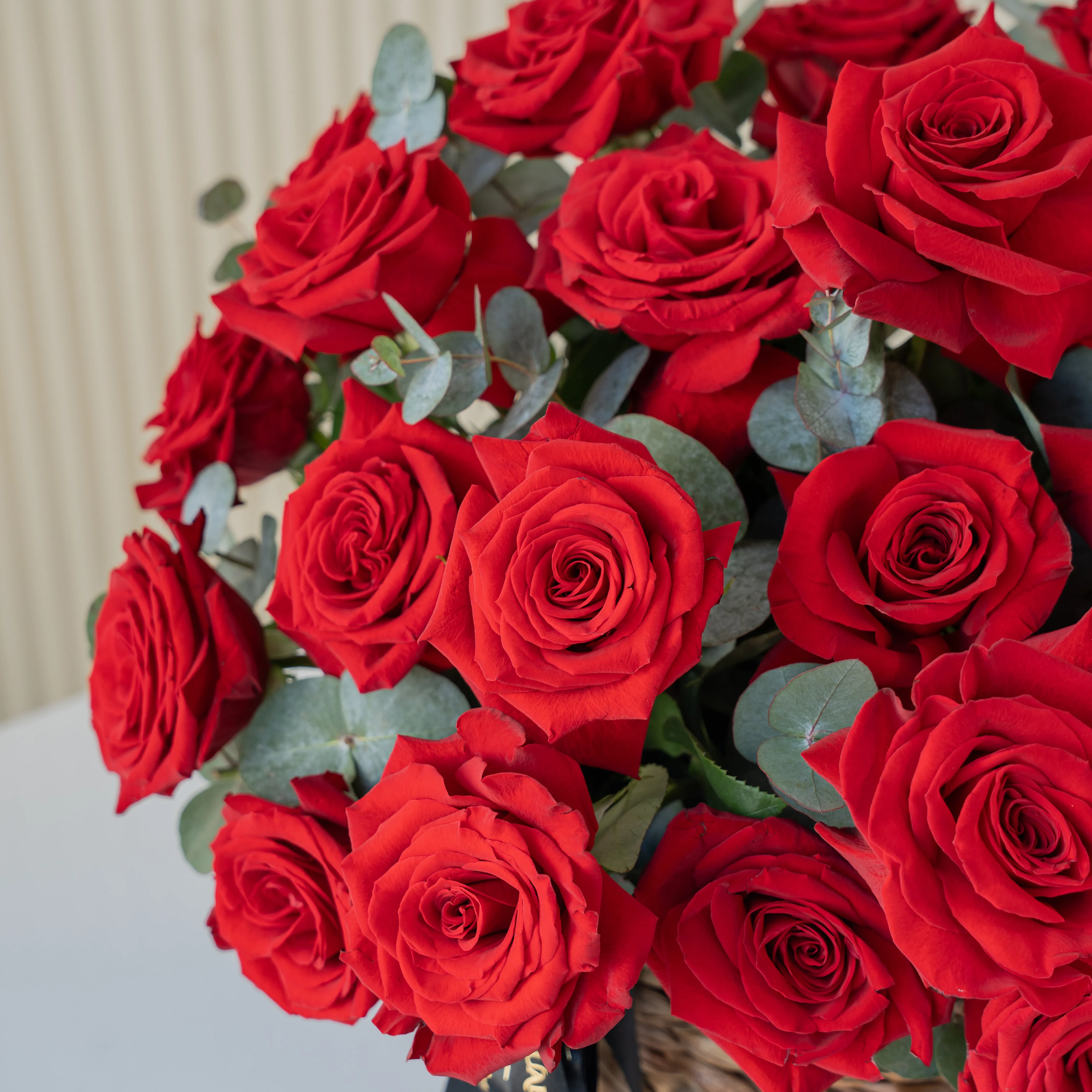 20 Opened Red Roses in a Round Basket