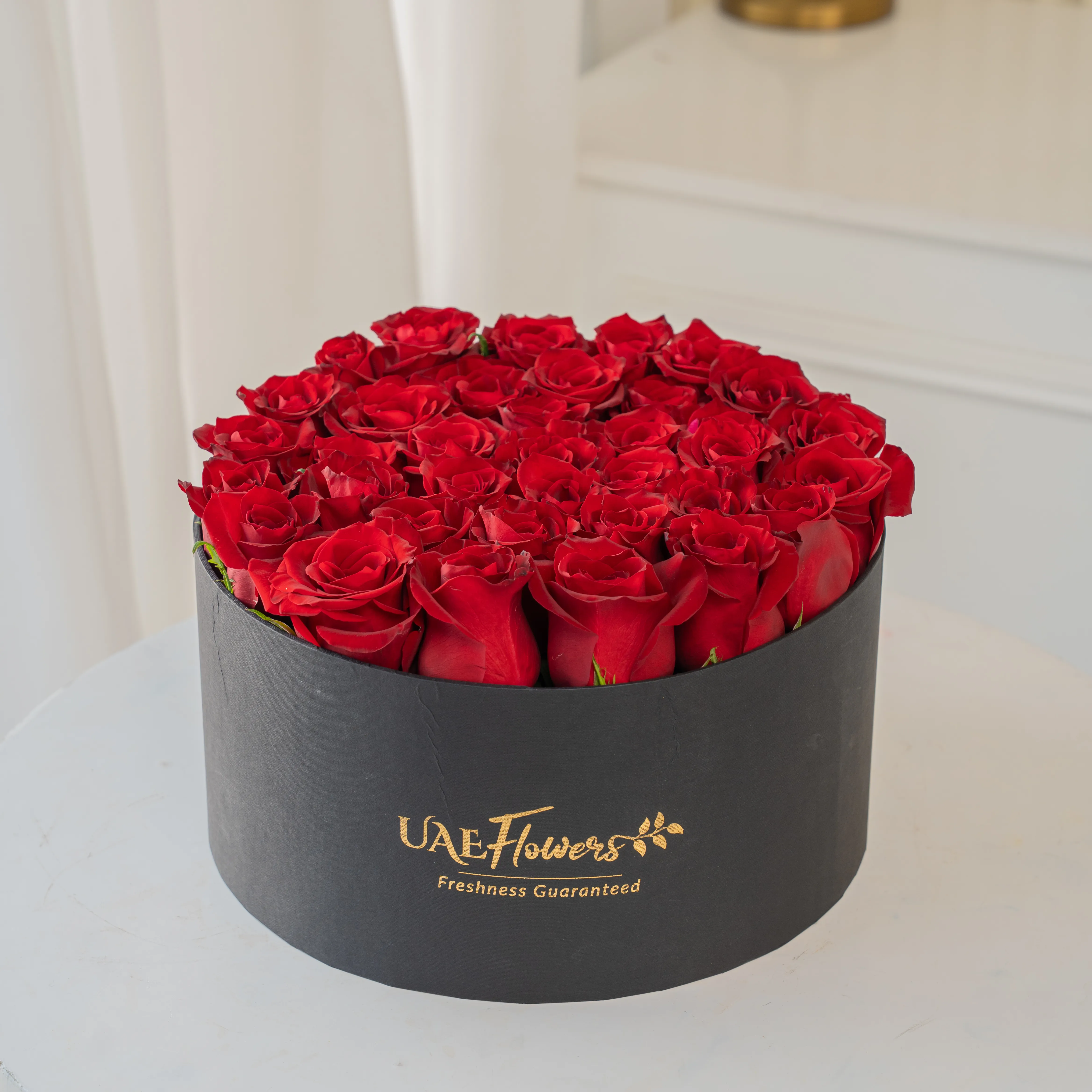30 Red Roses in a premium black round box