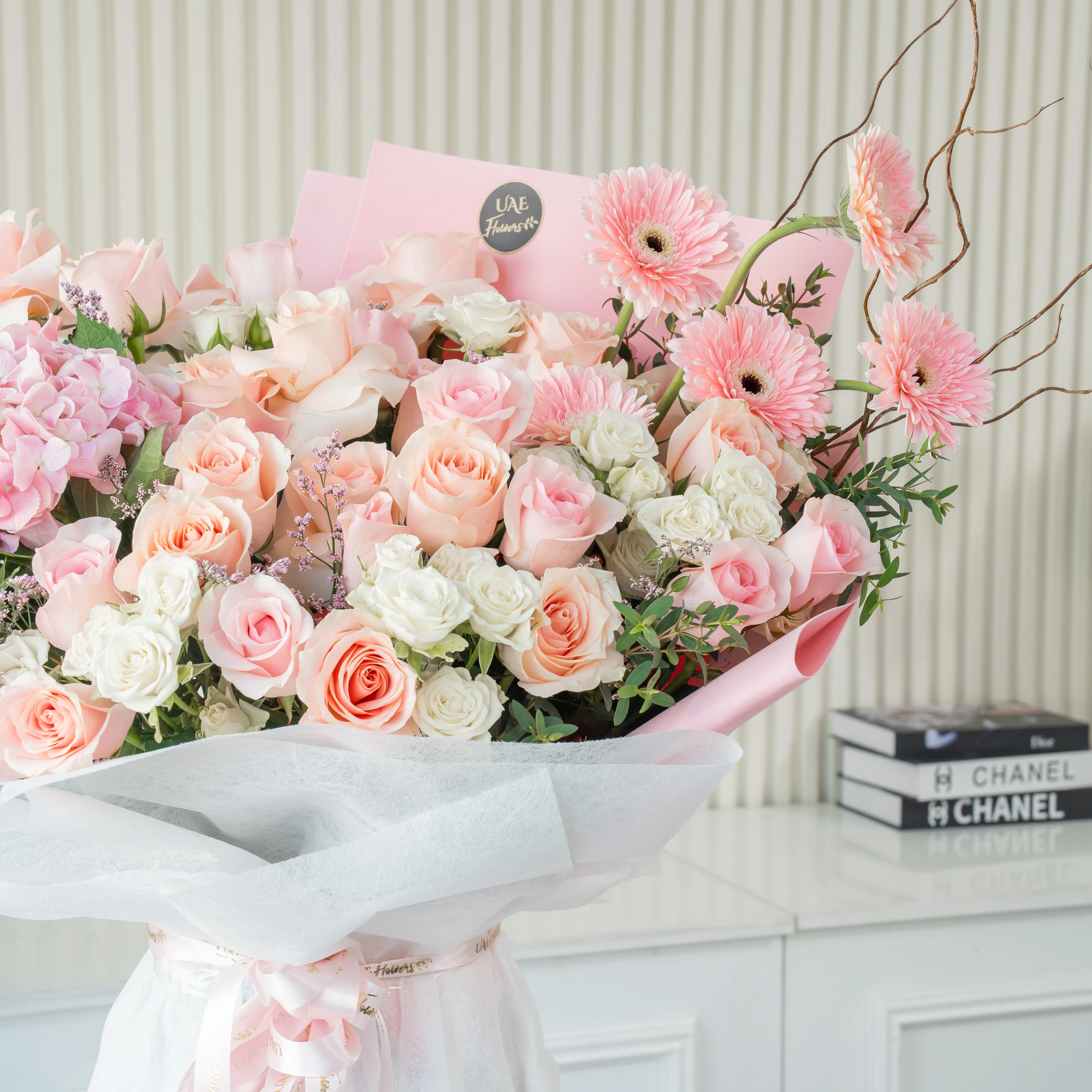 bouquet of pink roses, gerberas,  white spray roses, and hydrangea