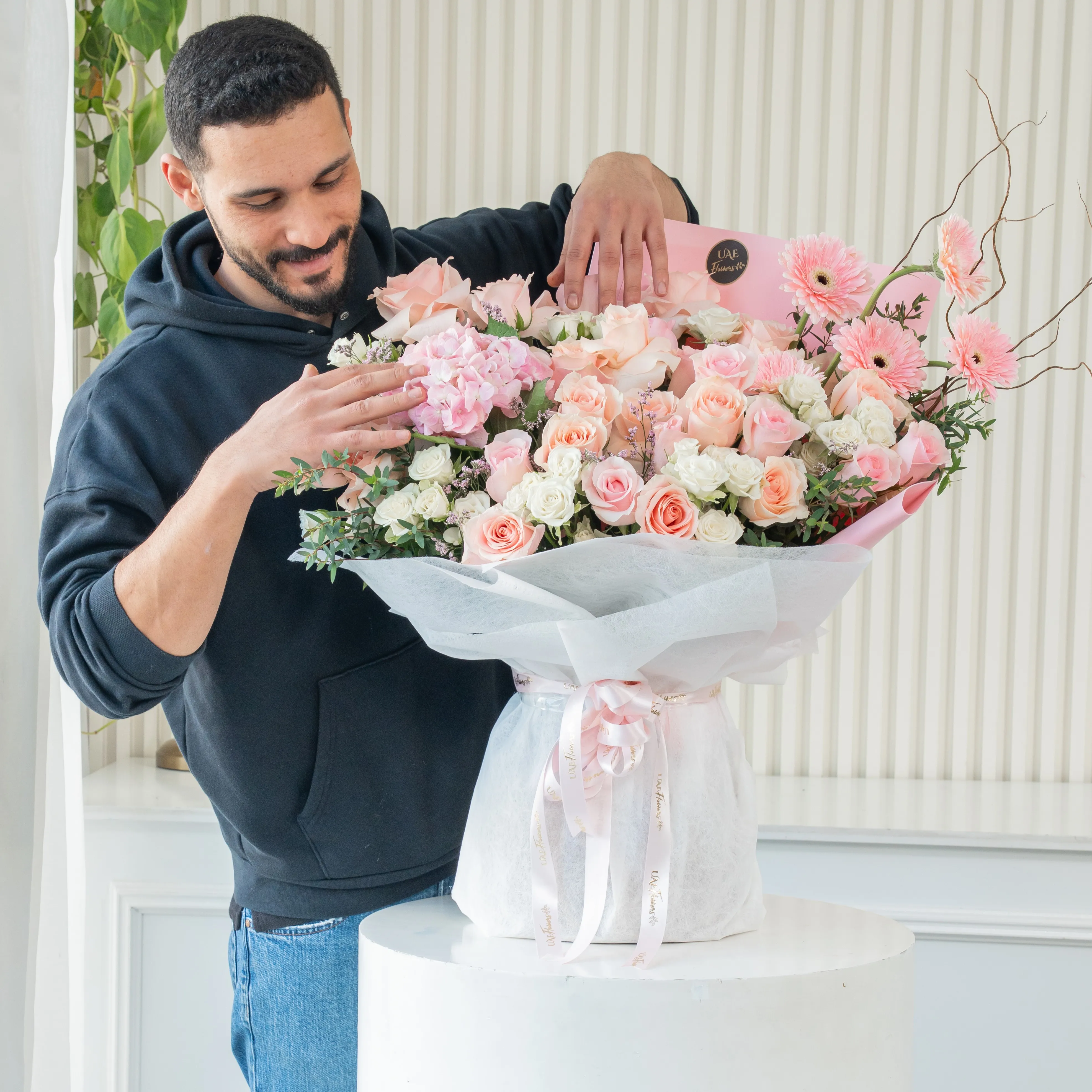bouquet of pink roses, gerberas,  white spray roses, and hydrangea