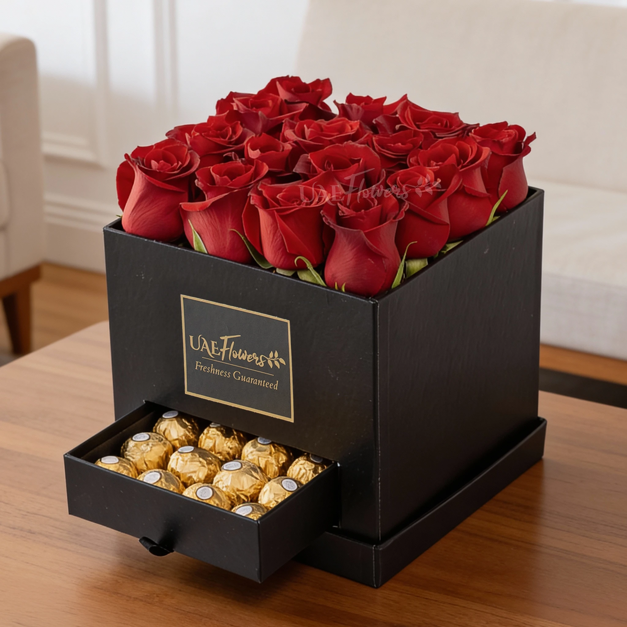Black gift box with 16 red roses and 16 Ferrero Rocher chocolates, perfect for romantic occasions, anniversaries, or expressing love.
