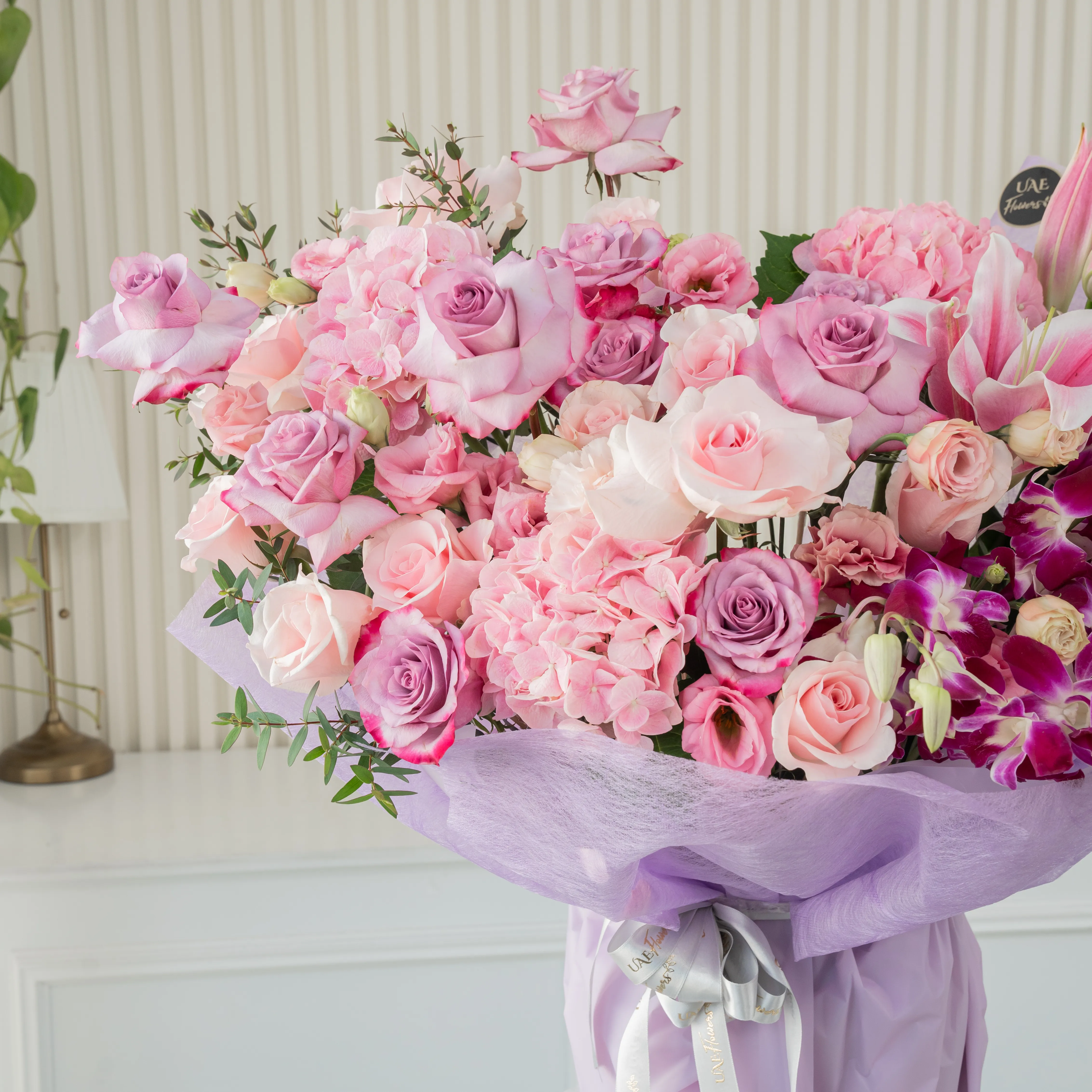 bouquet with pink, lilies, roses, hydrangeas, purple orchids