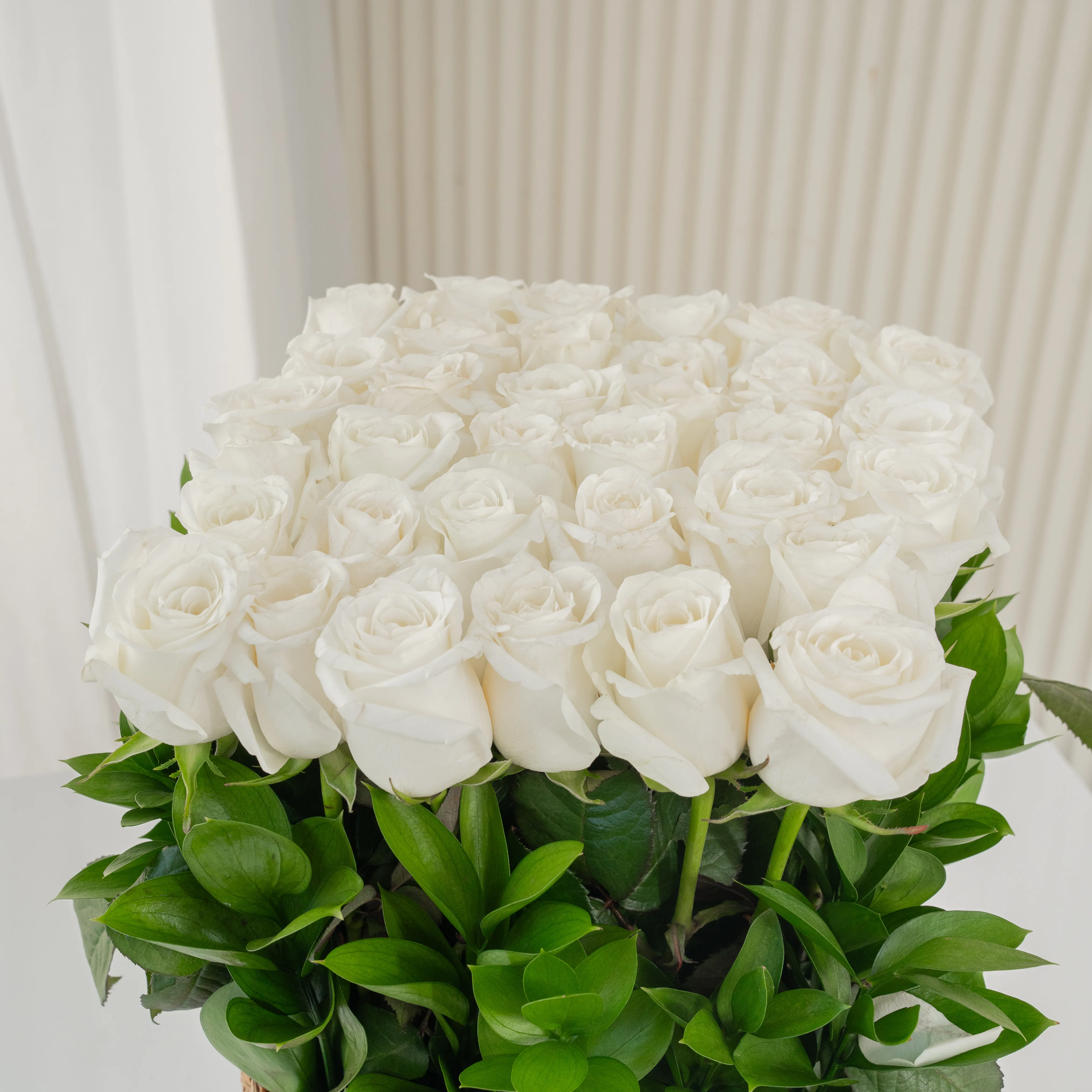 18 White Roses in a Square Basket