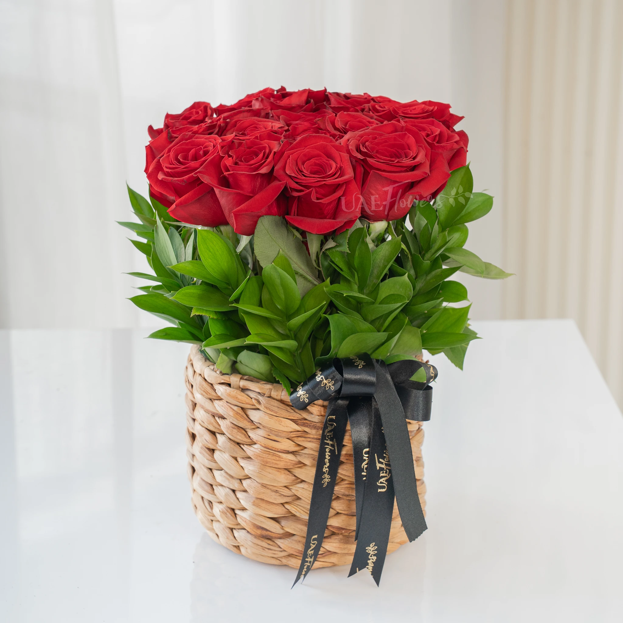 12 Red Roses in a Round Basket