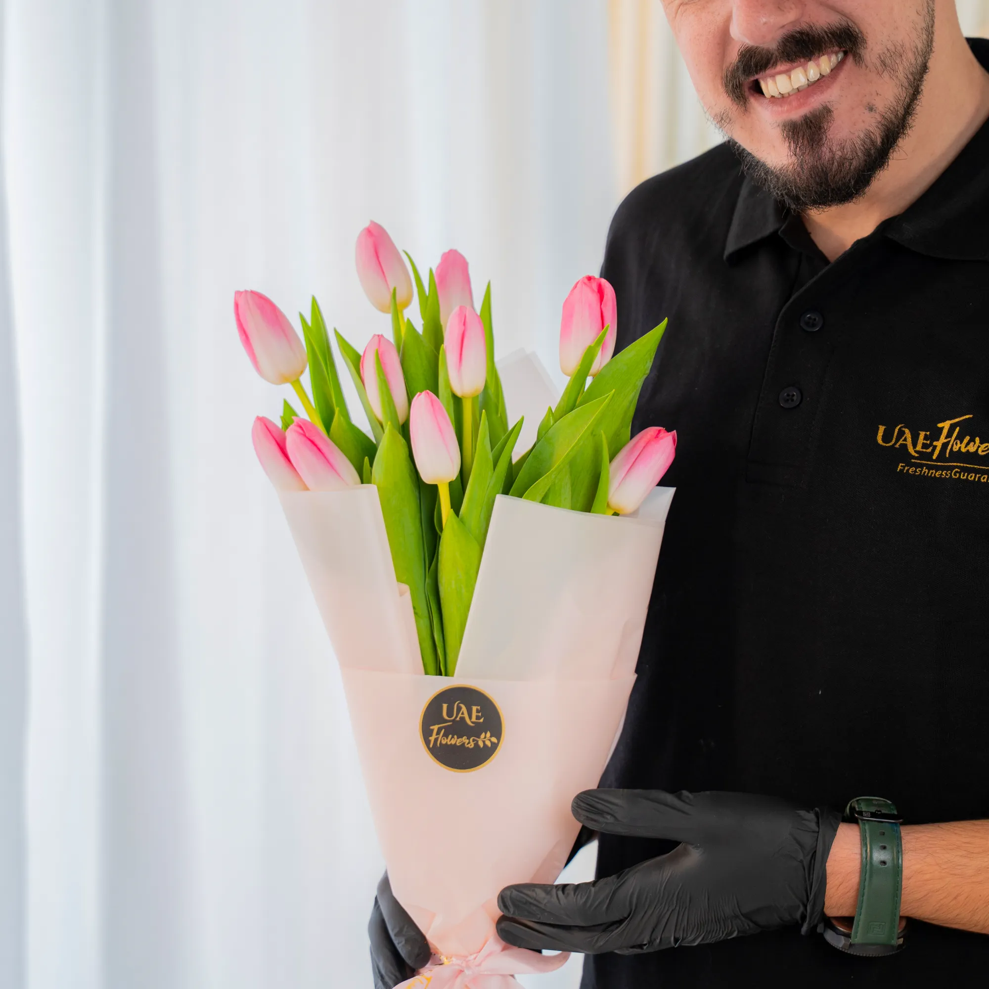 10 pink tulips is wrapped in stylish pink paper
