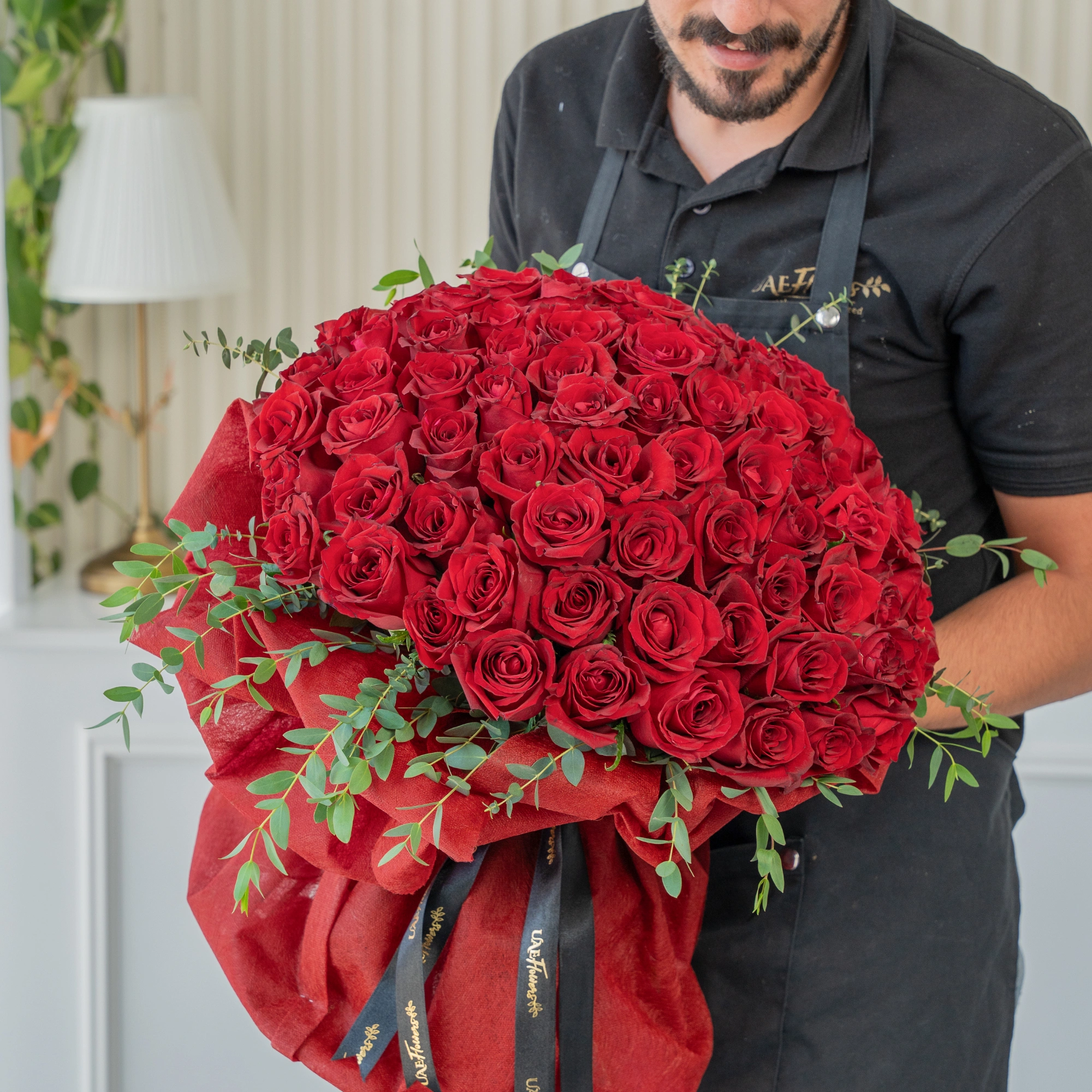 Bouquet of 60 Red Roses with green fillers in nice wrapping