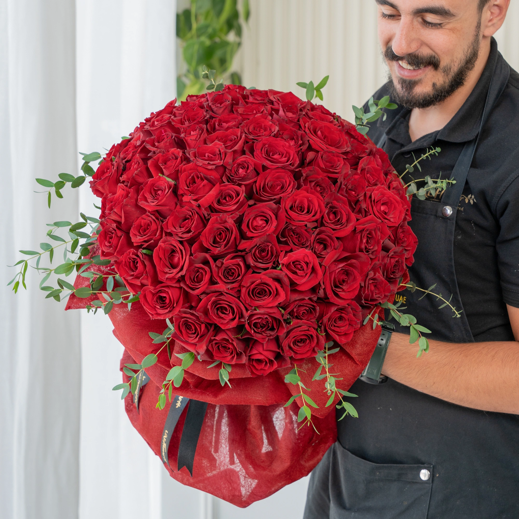 Bouquet of 60 Red Roses with green fillers in nice wrapping