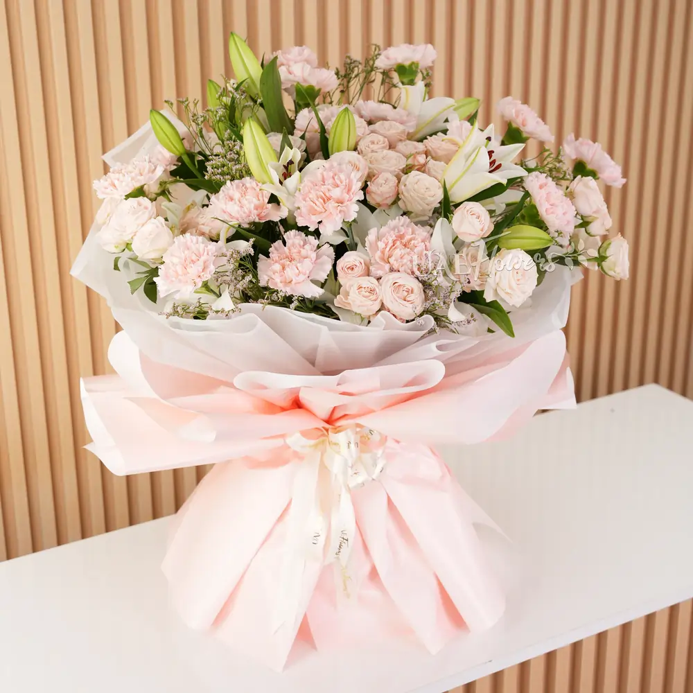 5 white lilies, 10 pink carnations, and 10 pink spray roses with green fillers,