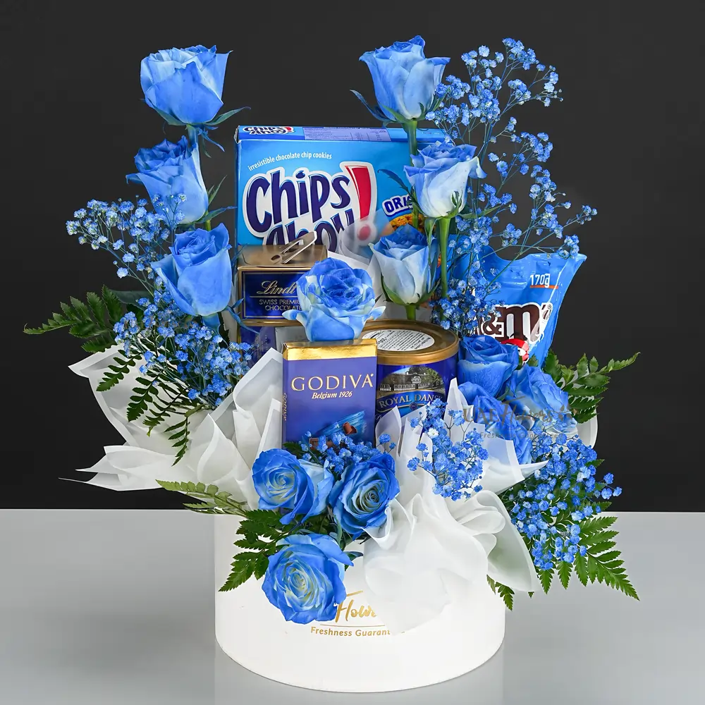 Chips Ahoy 300g, Danish Butter Cookies 200g, M&Ms 170g, Lindt 350g, Godiva 90g, 15 blue roses, baby’s breath