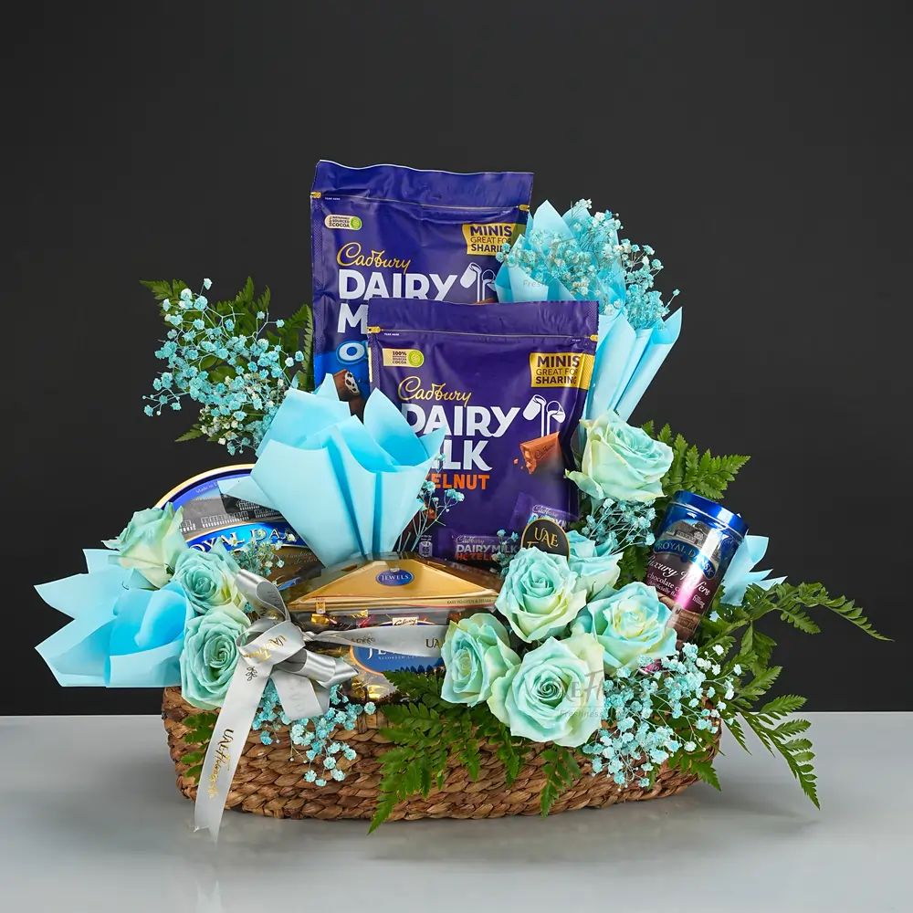 A gift hamper with Cadbury Dairy Milk, Galaxy Jewels, Royal Danish cookies,